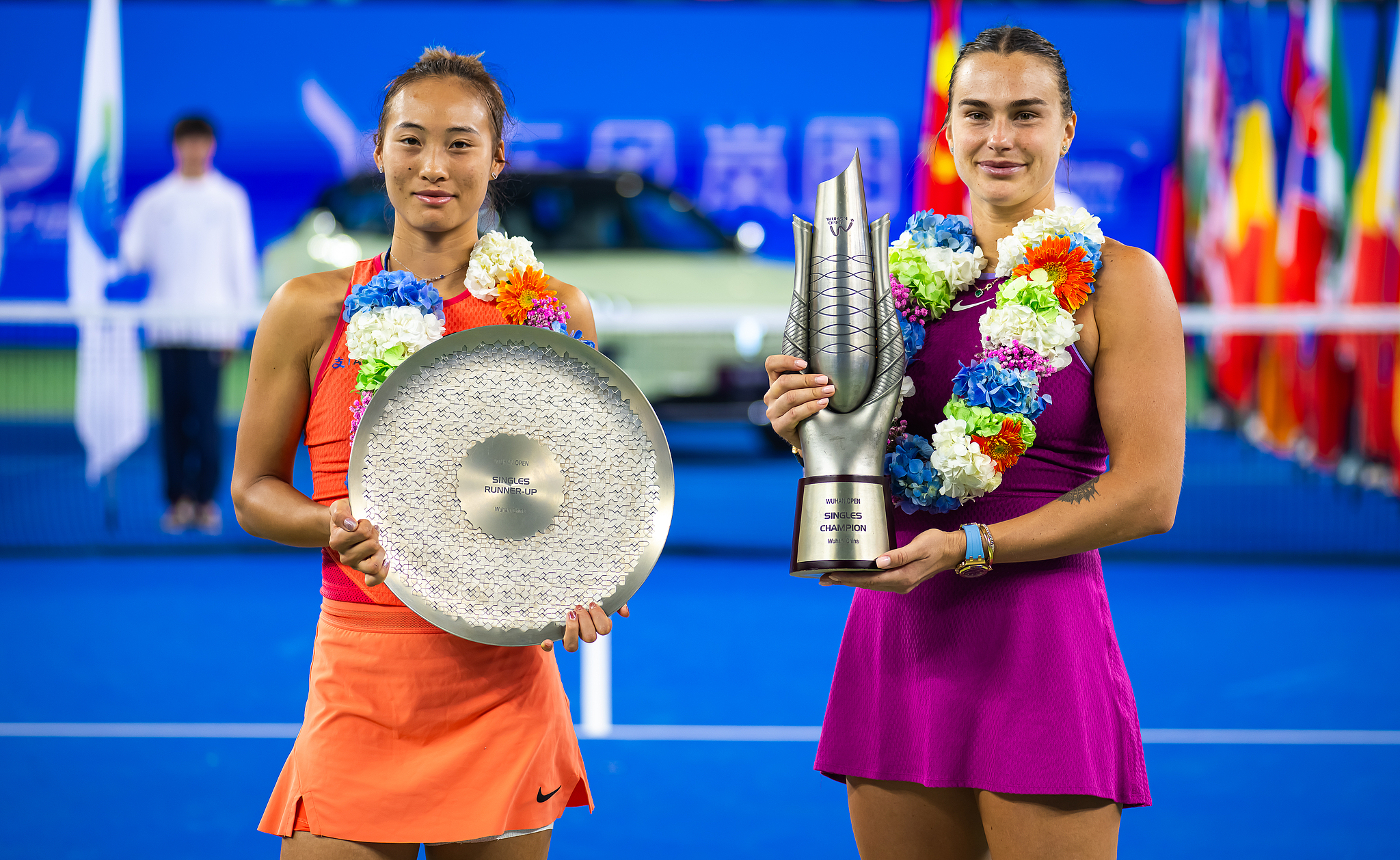 The women's singles champion Aryna Sabalenka (R) of Belarus and runner-up Zheng Qinwen of China pose for a photo after the final at the Wuhan Open in Wuhan, central China's Hubei Province, October 13, 2024. /CFP