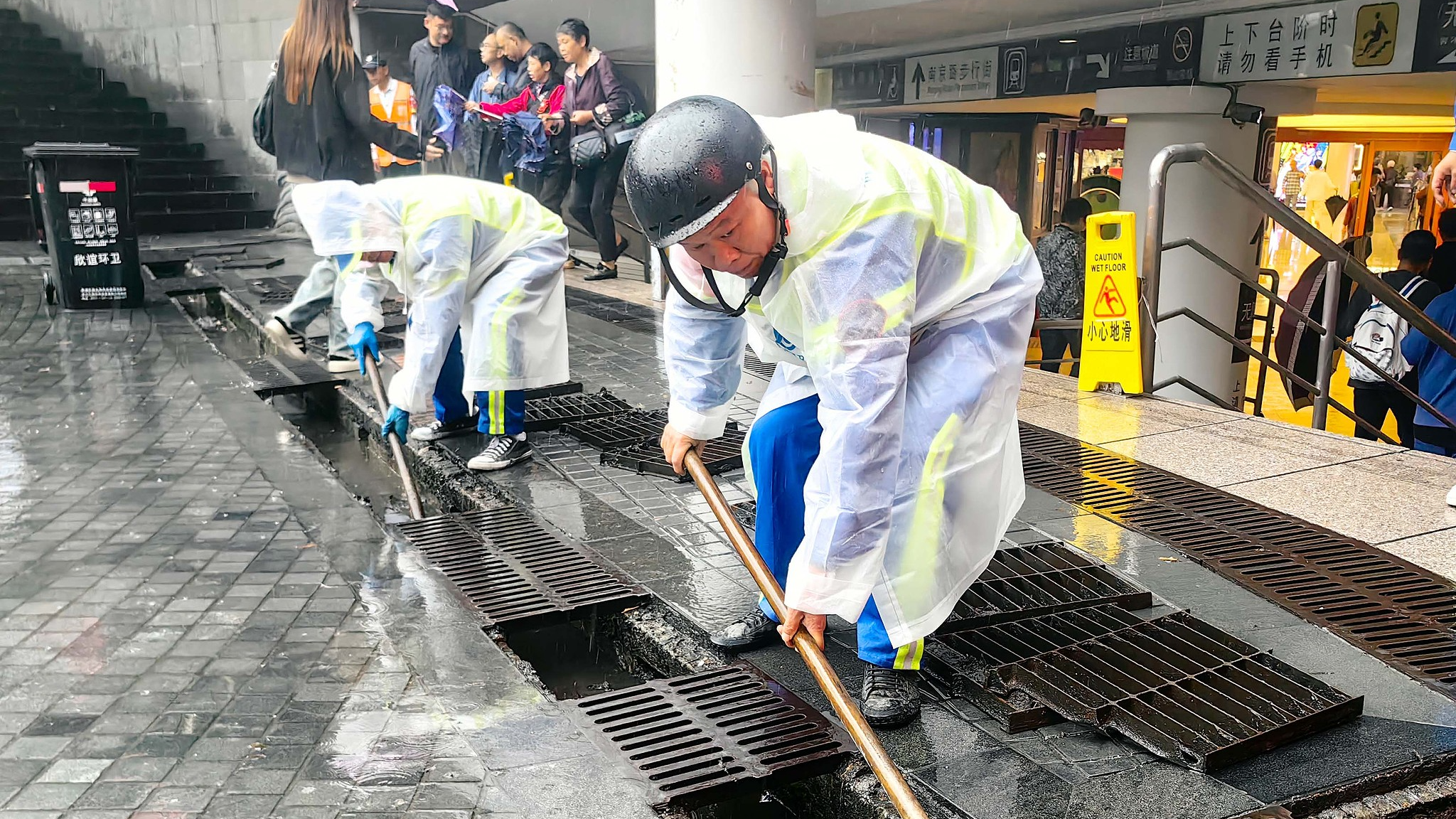 Shanghai is expected to experience the heaviest rainfall for this time of year in 43 years due to Typhoon Kong-rey. In the morning, workers at some sunken plazas cleared debris from drainage ditches to prevent rainwater from overflowing, October 31, 2024. /CFP