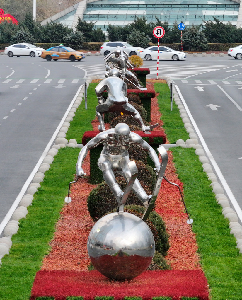 Stainless steel sculptures of winter sports athletes are seen on the streets of Harbin, Heilongjiang Province on October 29, 2024. /CFP