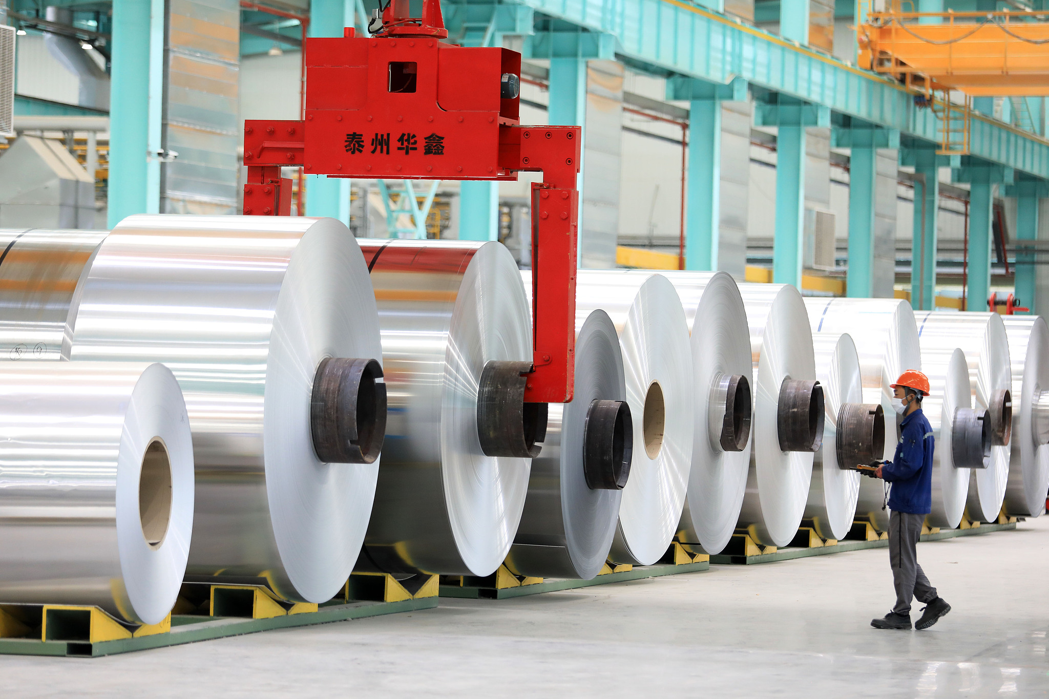 A worker makes ordered products at a workshop of a company of renewable low-carbon aluminum heat transfer materials for new energy in Huaibei, east China's Anhui Province, October 3, 2024. /CFP