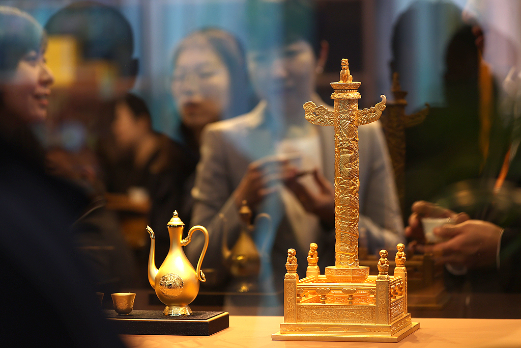 Gold handicrafts are displayed at the Beijing International Coin Exposition on November 1, 2024. /CFP