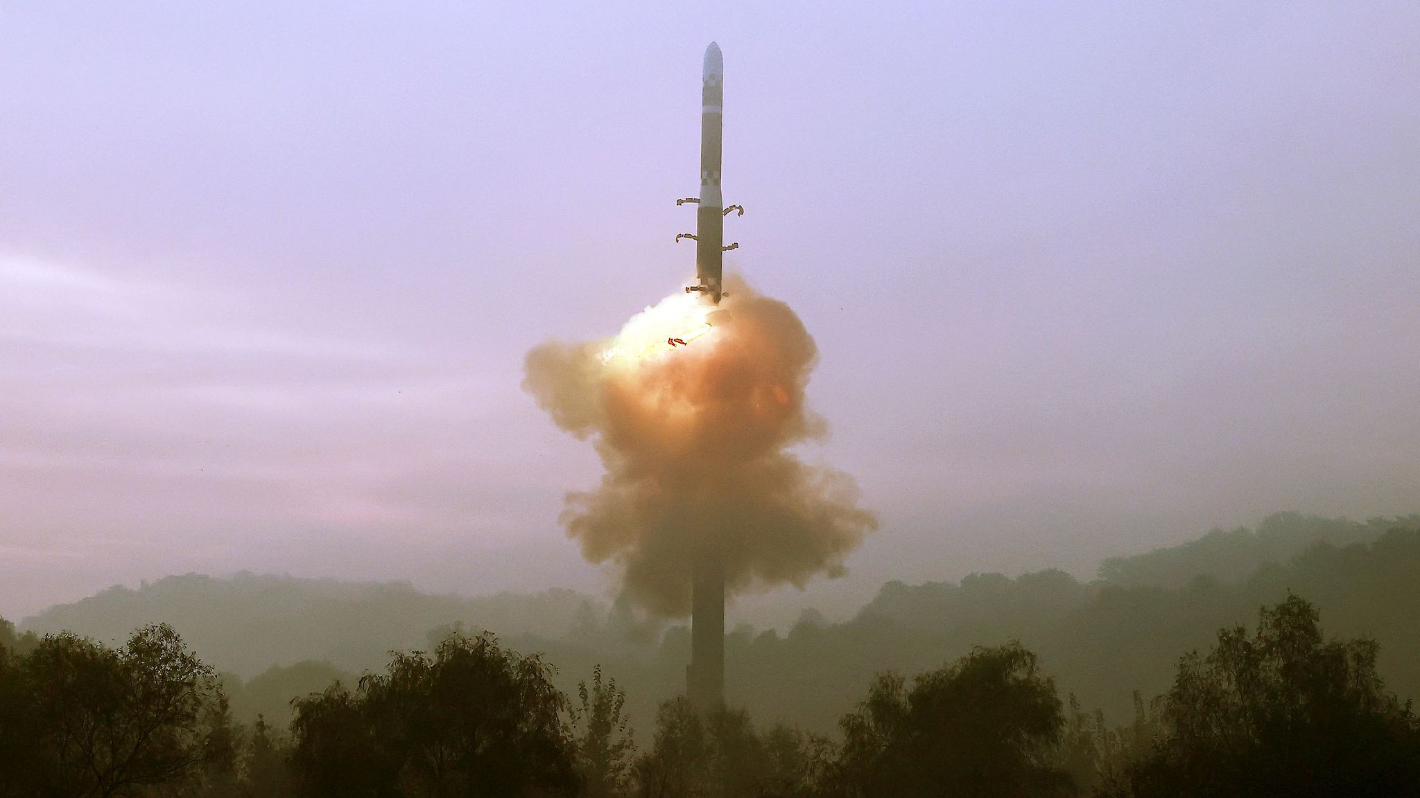 This photo, taken on October 31, 2024, and released by the DPRK's Korean Central News Agency on November 1, shows the test-fire of the new Hwasongpho-19 ICBM at an undisclosed location.