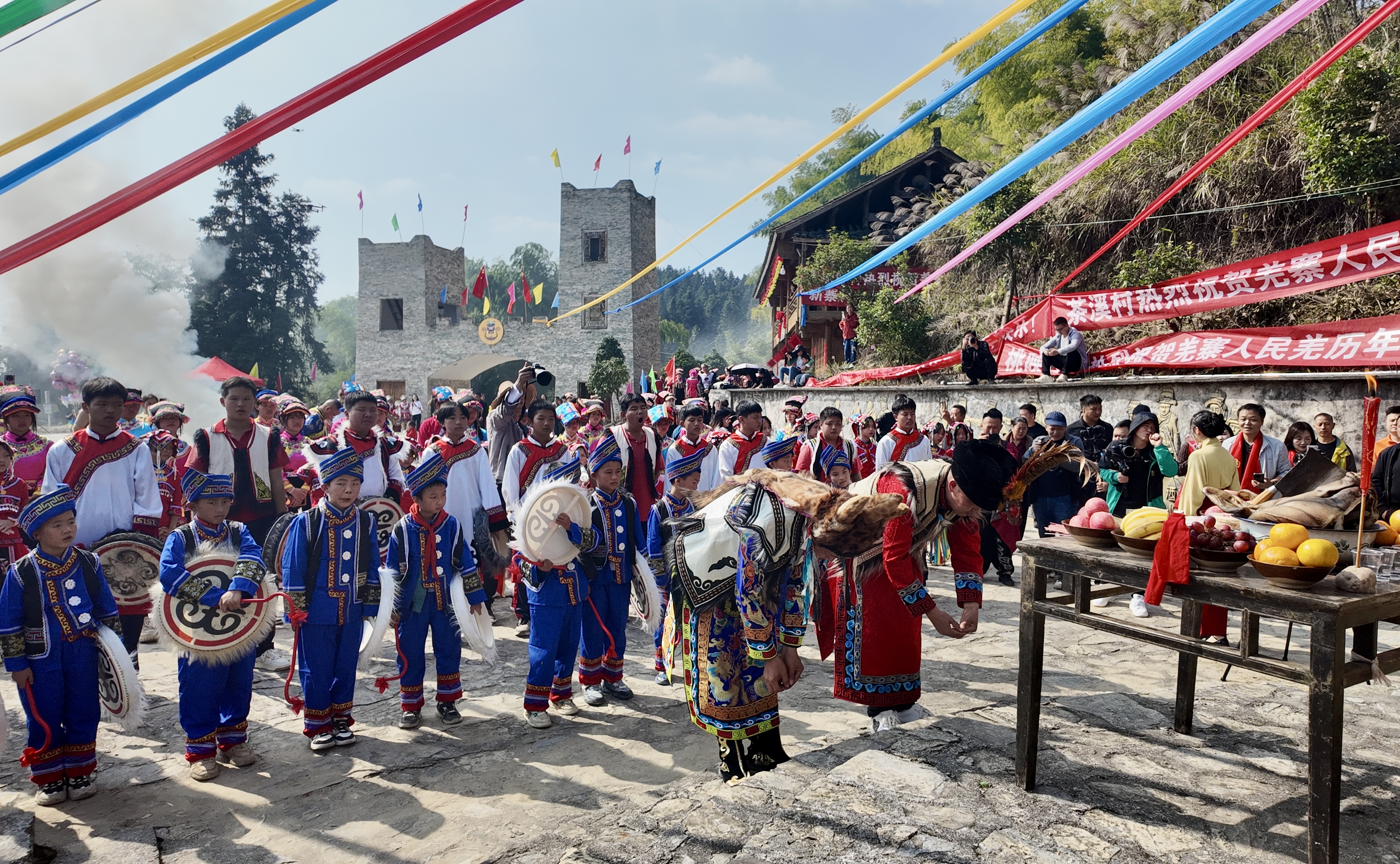 People of the Qiang ethnic group dressed in traditional costumes celebrate the Qiang New Year in a village in Jiangkou County, Tongren City, Guizhou Province, November 1, 2024. /Provided to CGTN