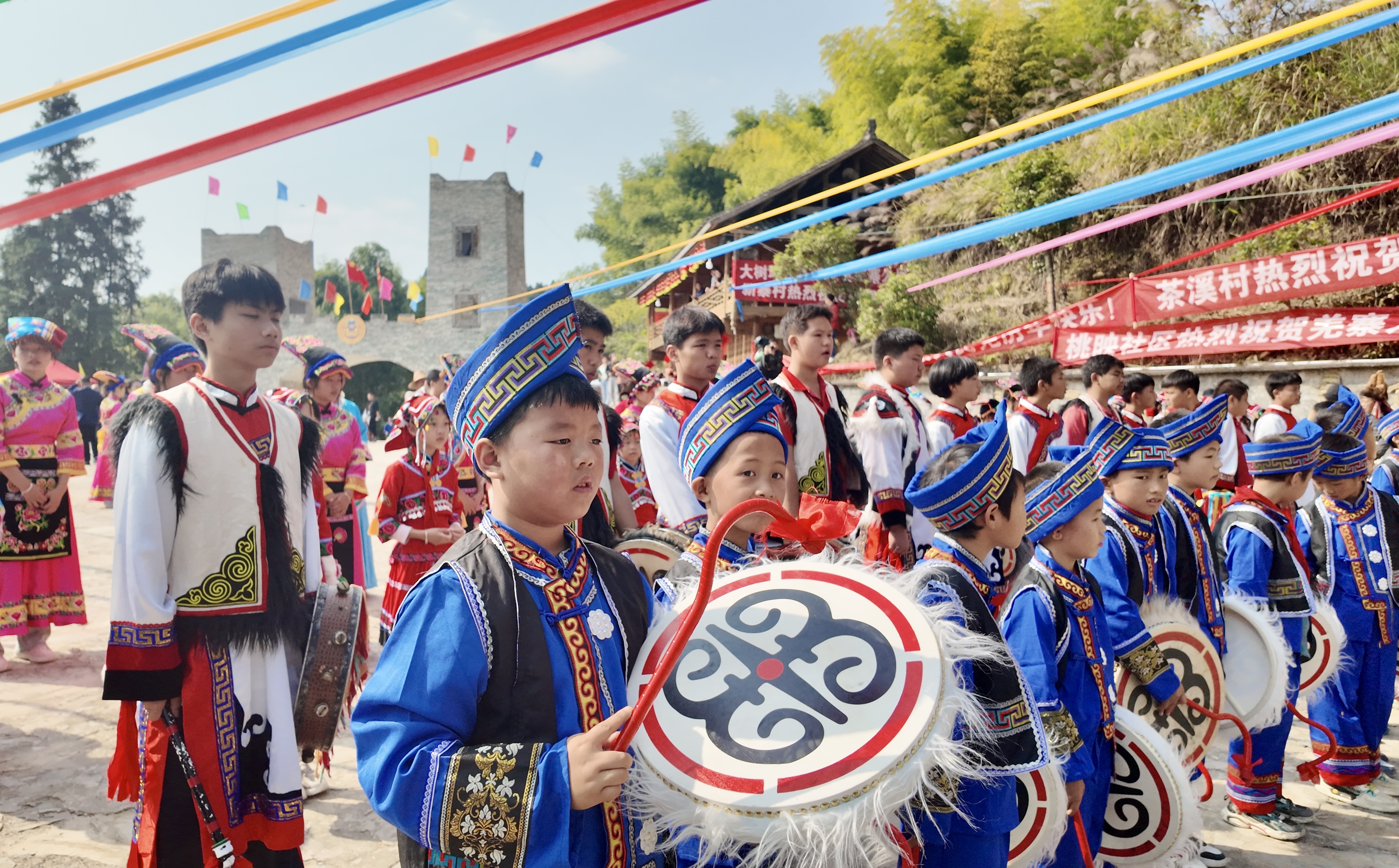 People of the Qiang ethnic group dressed in traditional costumes celebrate the Qiang New Year in a village in Jiangkou County, Tongren City, Guizhou Province, November 1, 2024. /Provided to CGTN