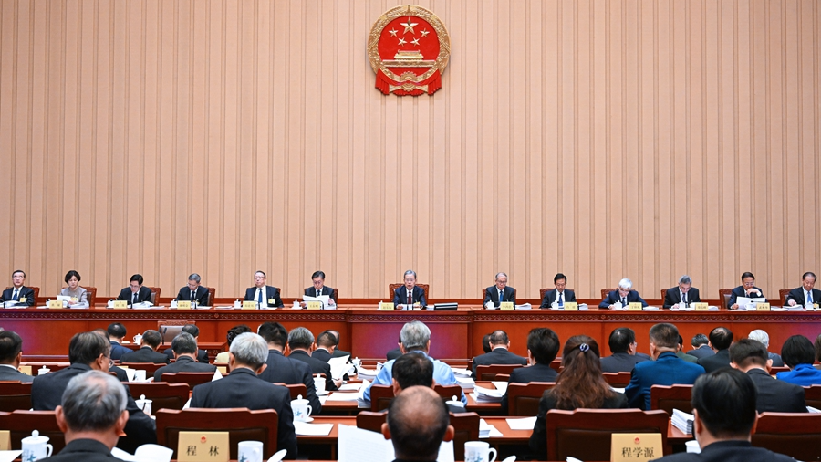 Zhao Leji, chairman of the National People's Congress (NPC) Standing Committee, presides over the first plenary meeting of the 12th session of the 14th NPC Standing Committee at the Great Hall of the People in Beijing, China, November 4, 2024. /Xinhua