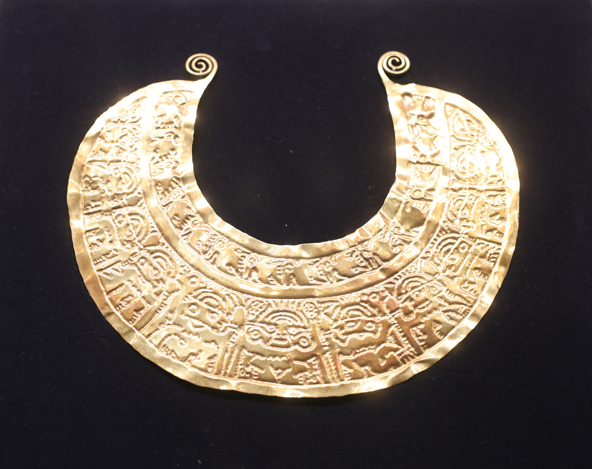 A golden necklace is on display at 