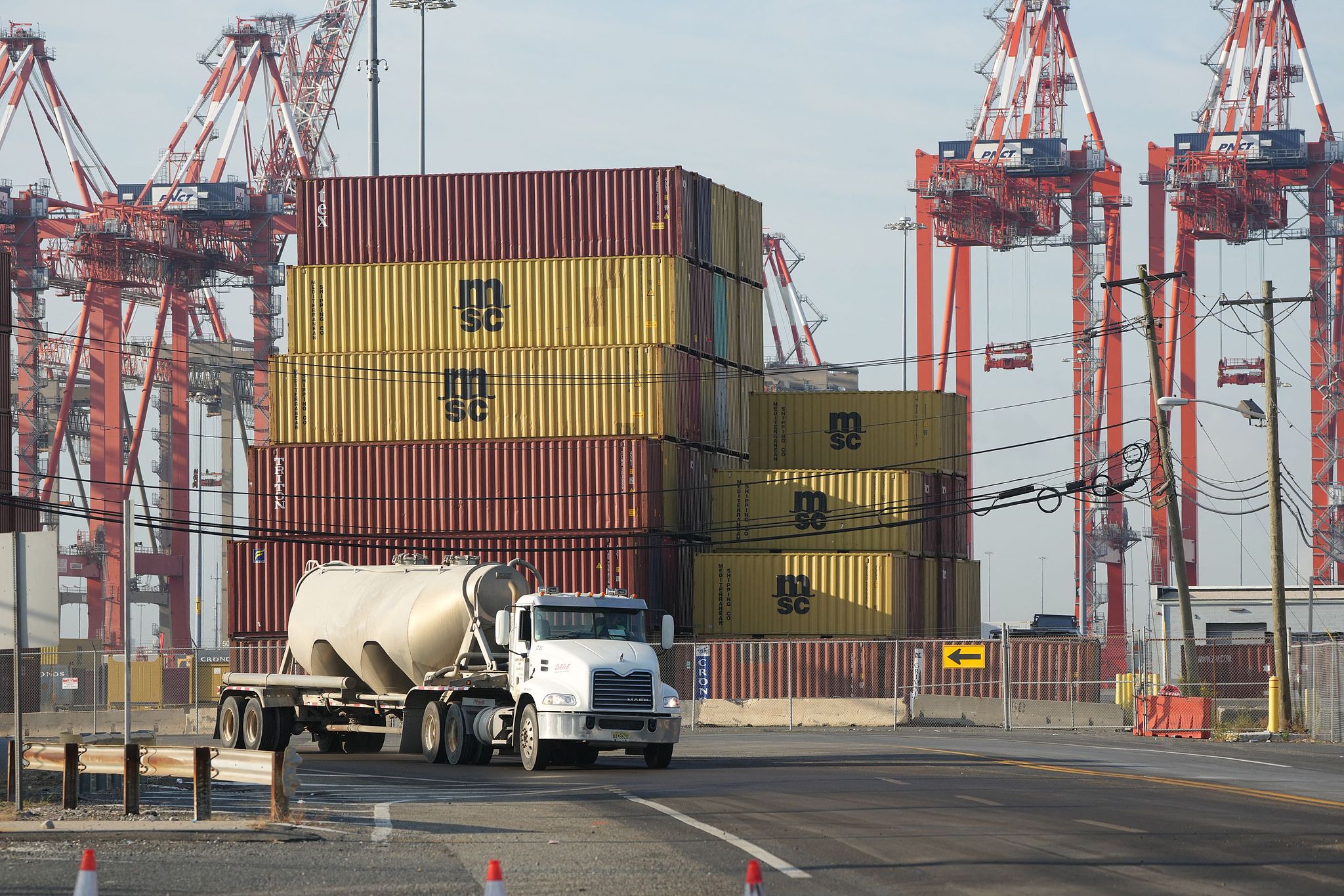 A truck drives past shipping containers at Port Newark, New Jersey, US, on October 4, 2024. /CFP