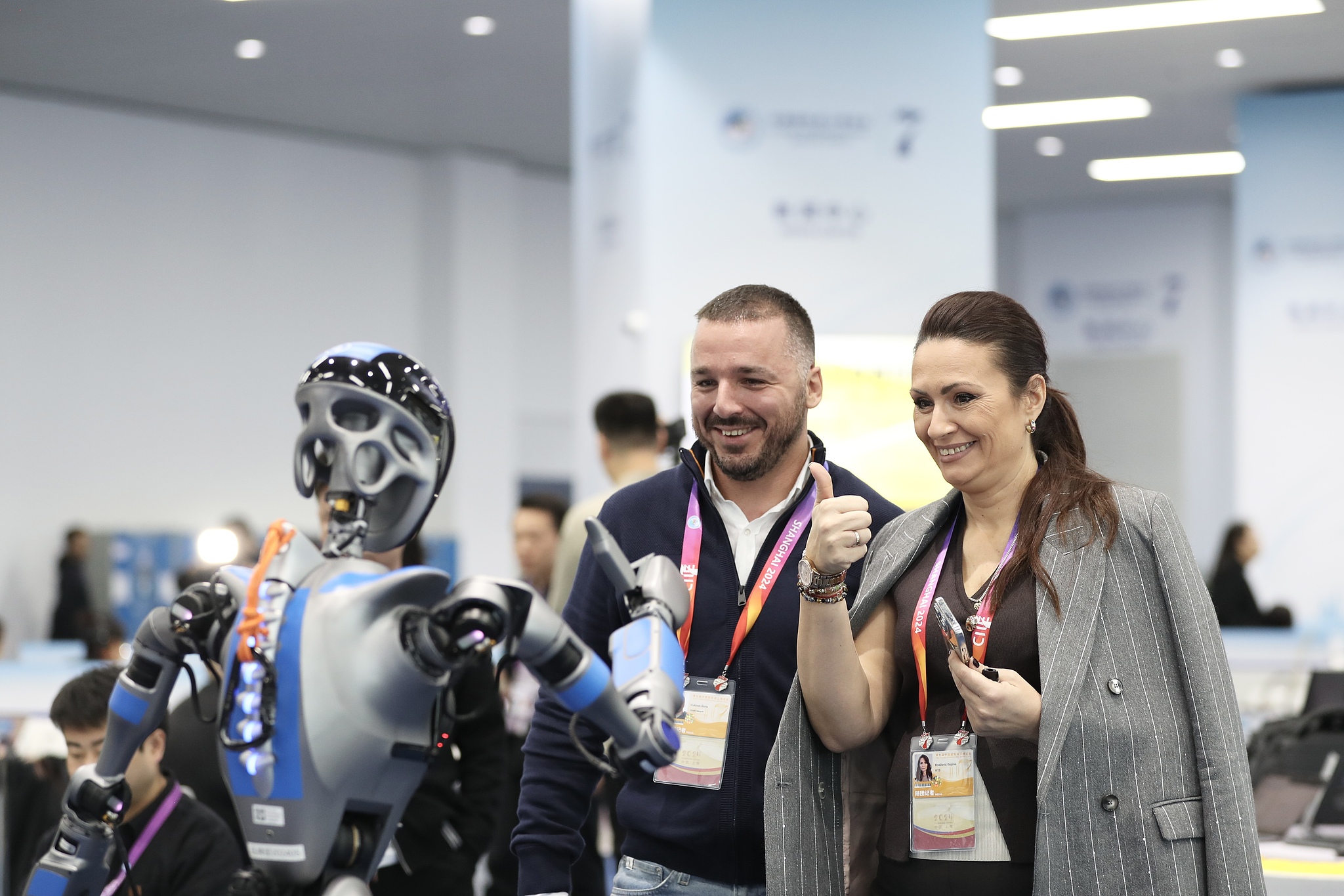 A humanoid robot interacts with visitors during the 7th China International Import Expo in Shanghai, November 5, 2024. /CFP