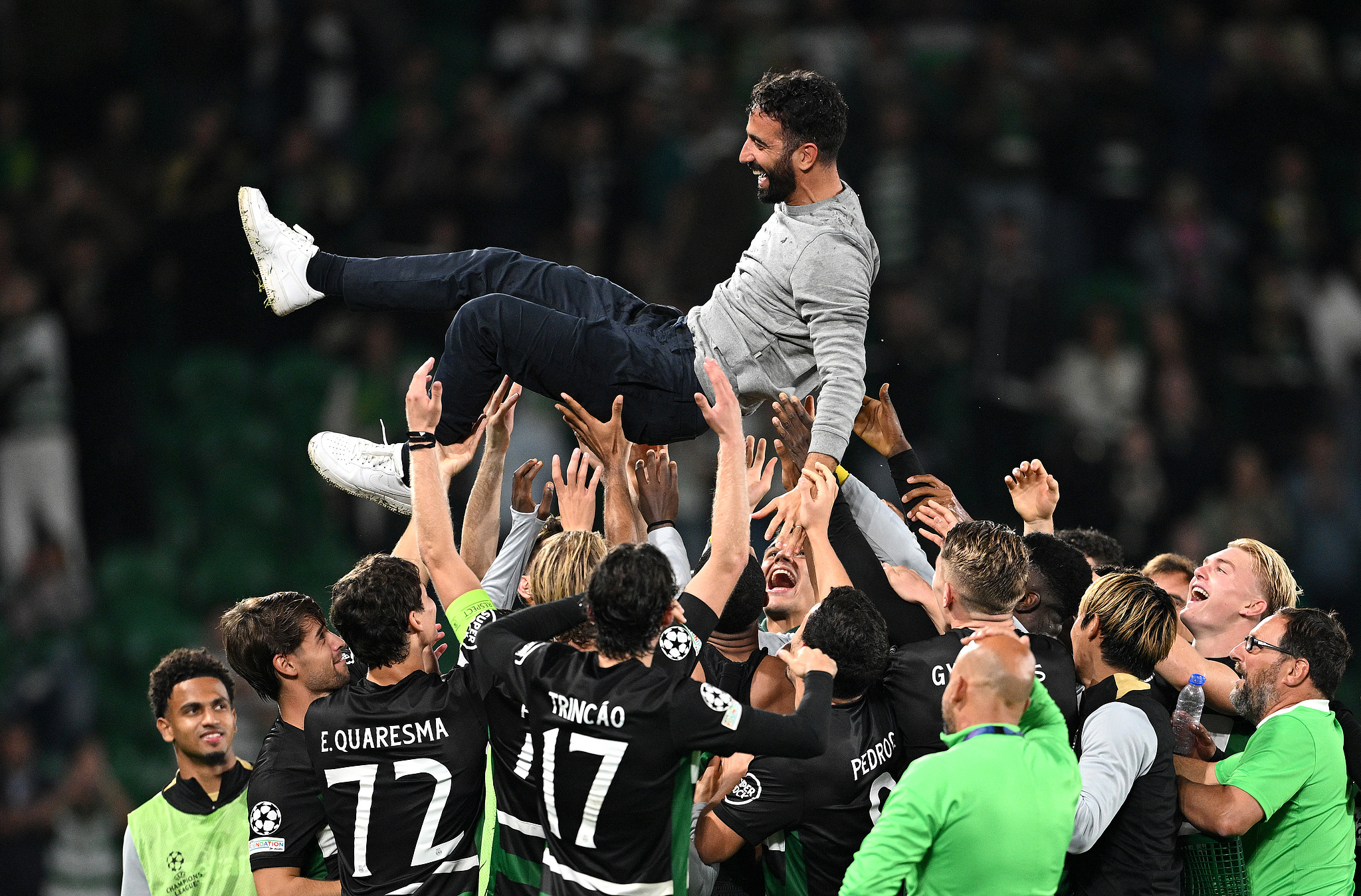 Ruben Amorim, head coach of Sporting, is thrown into the air by his players to celebrate his last home match as manager after their Champions League match against Manchester City in Lisbon, Portugal, November 5, 2024. /CFP