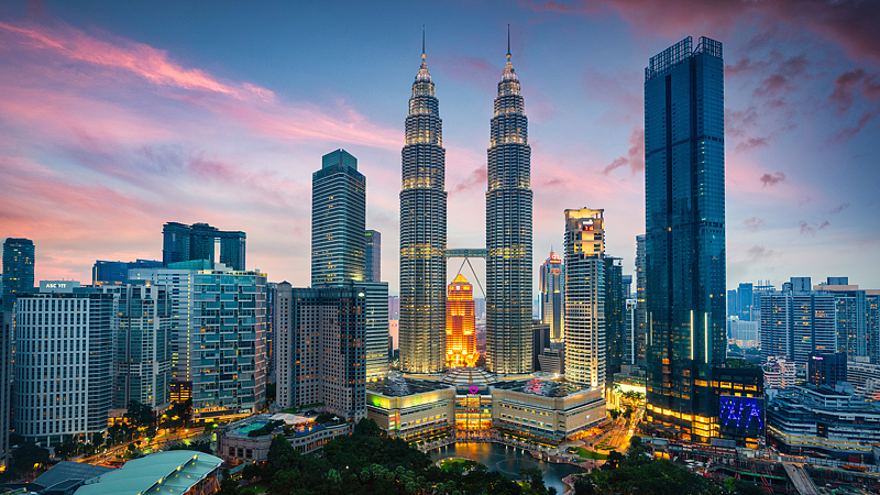 An undated photo shows Petronas Towers at sunset in Kuala Lumpur, Malaysia. /CFP