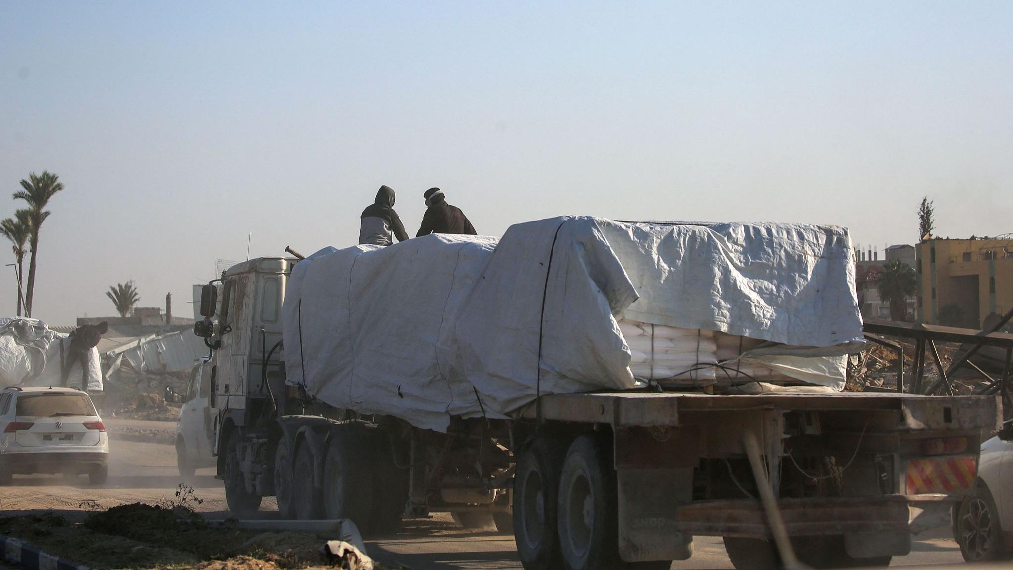 Trucks loaded with aid drive down the Salaheddin road in the central town of Deir el-Balah in the besieged Gaza Strip, November 5, 2024. /CFP