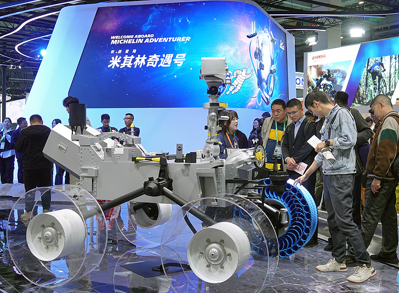 Visitors learn about Michelin lunar rover tires at the 7th China International Import Expo in Shanghai, November 6, 2024. /CFP