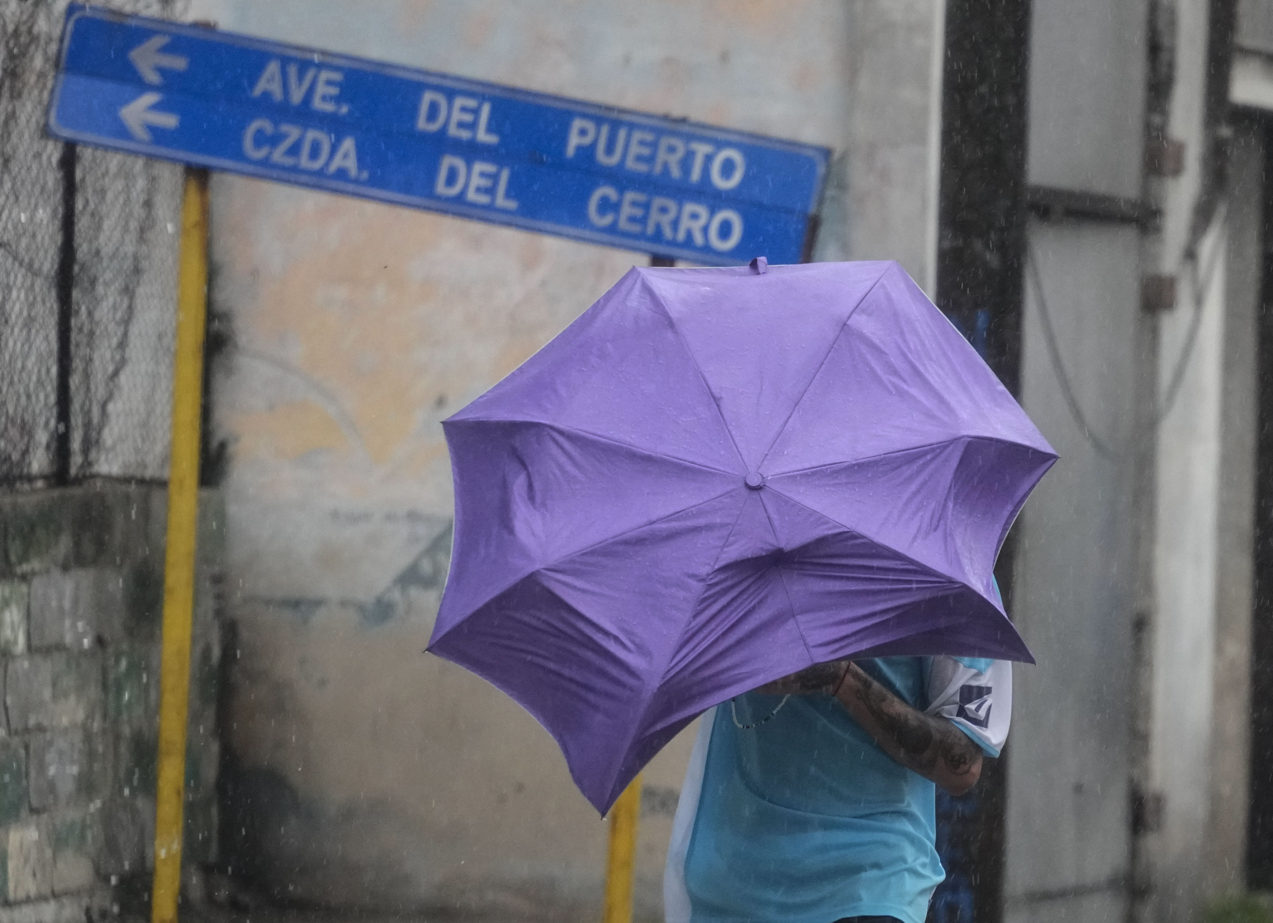 A man walks through the wind and rain brought by Hurricane Rafael in Havana, Cuba, November 6, 2024. /AP