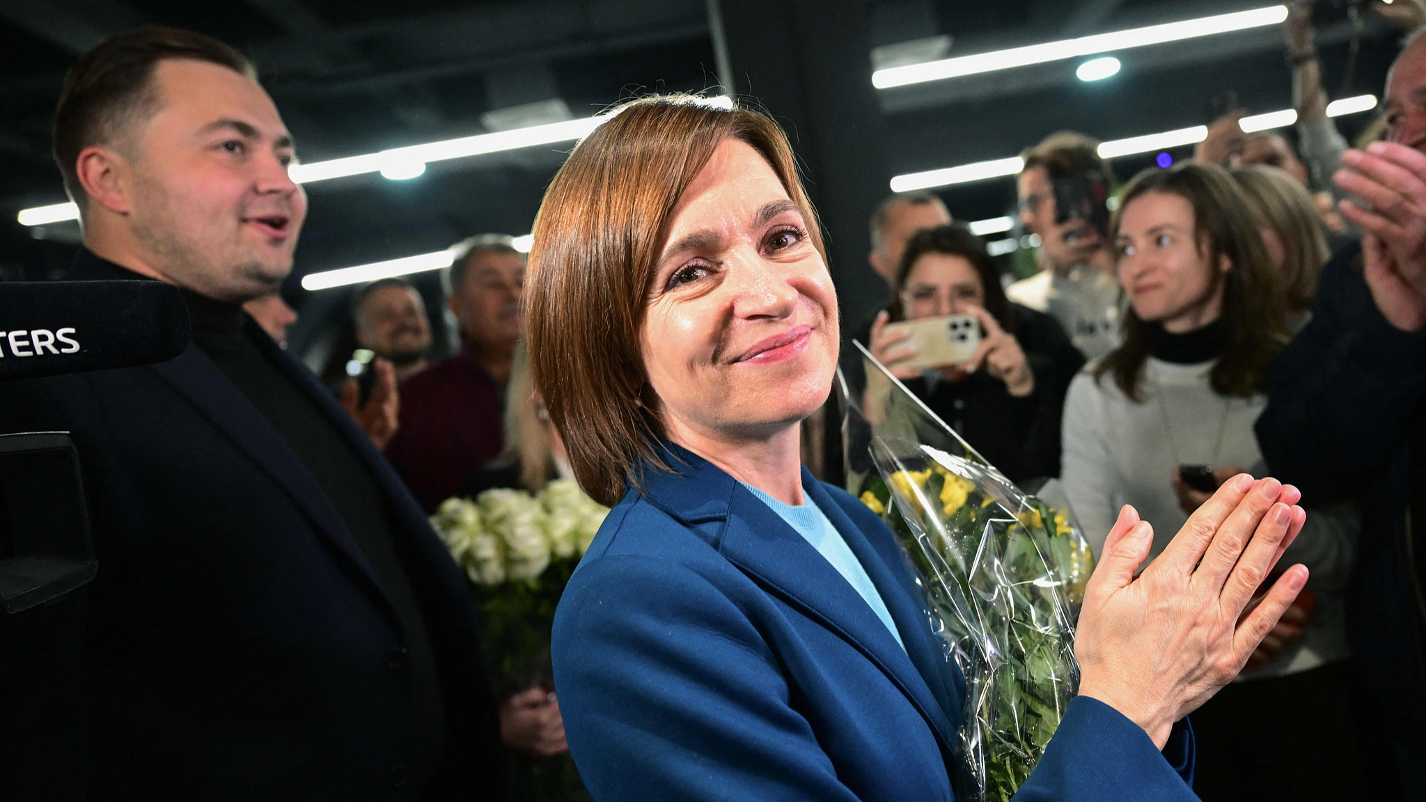 Maia Sandu celebrates with staff and supporters following preliminary results of the second round of the presidential election in Chisinau, capital of Moldova, November 3, 2024. /CFP