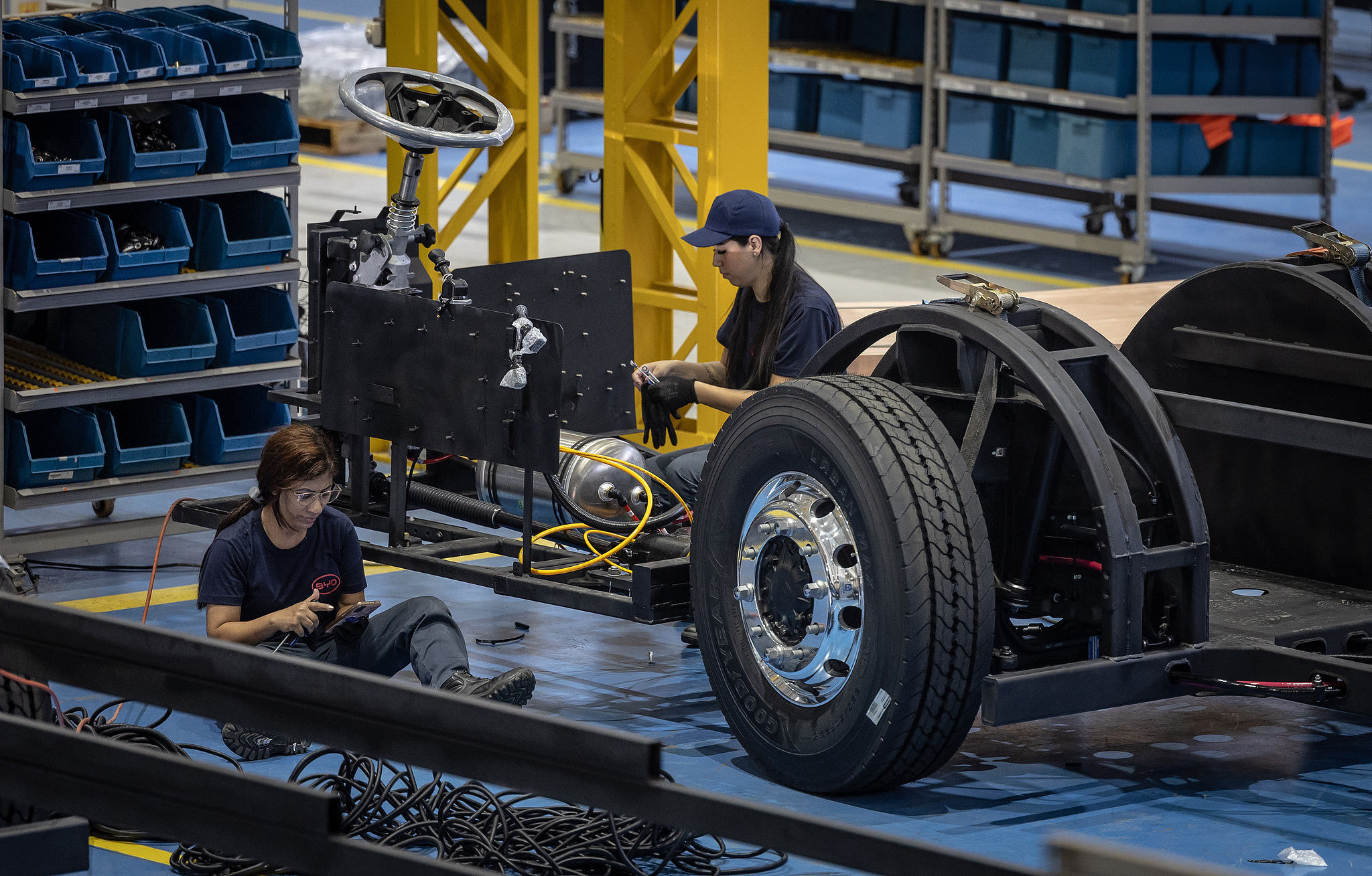 Workers assemble a chassis at the BYD solar panel and electric bus chassis production facility in Campinas, Sao Paulo state, Brazil, November 14, 2023. /CFP