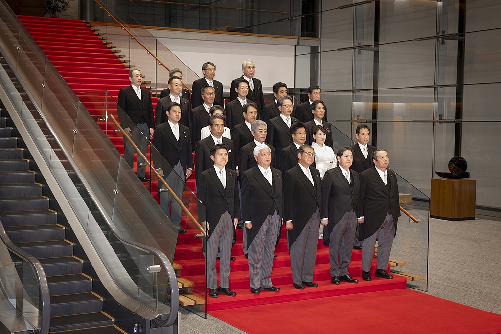 Japanese Prime Minister Shigeru Ishiba accompanied by his new cabinet members poses for a photo at his official residence in Tokyo on November 11, 2024. /CFP