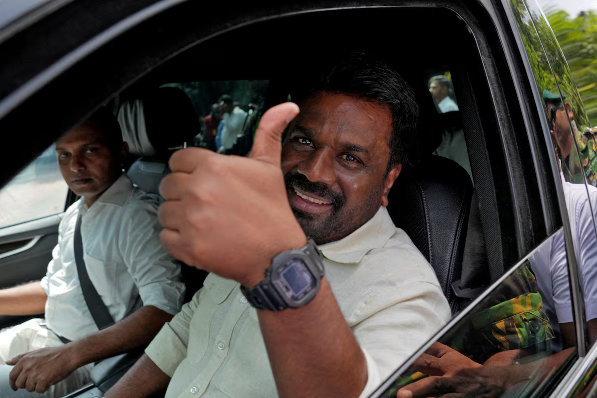 Sri Lankan President and National People's Power (NPP) party leader Anura Kumara Dissanayake gestures as he leaves after casting his vote in Colombo, Sri Lanka, November 14, 2024. /Reuters