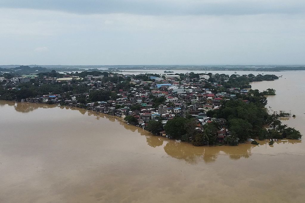 An aerial photo shows a swollen river inundating farm fields and houses a day after Typhoon Toraji hit, Ilagan town, Isabela province, Luzon, the Philippines, November 12, 2024. /CFP