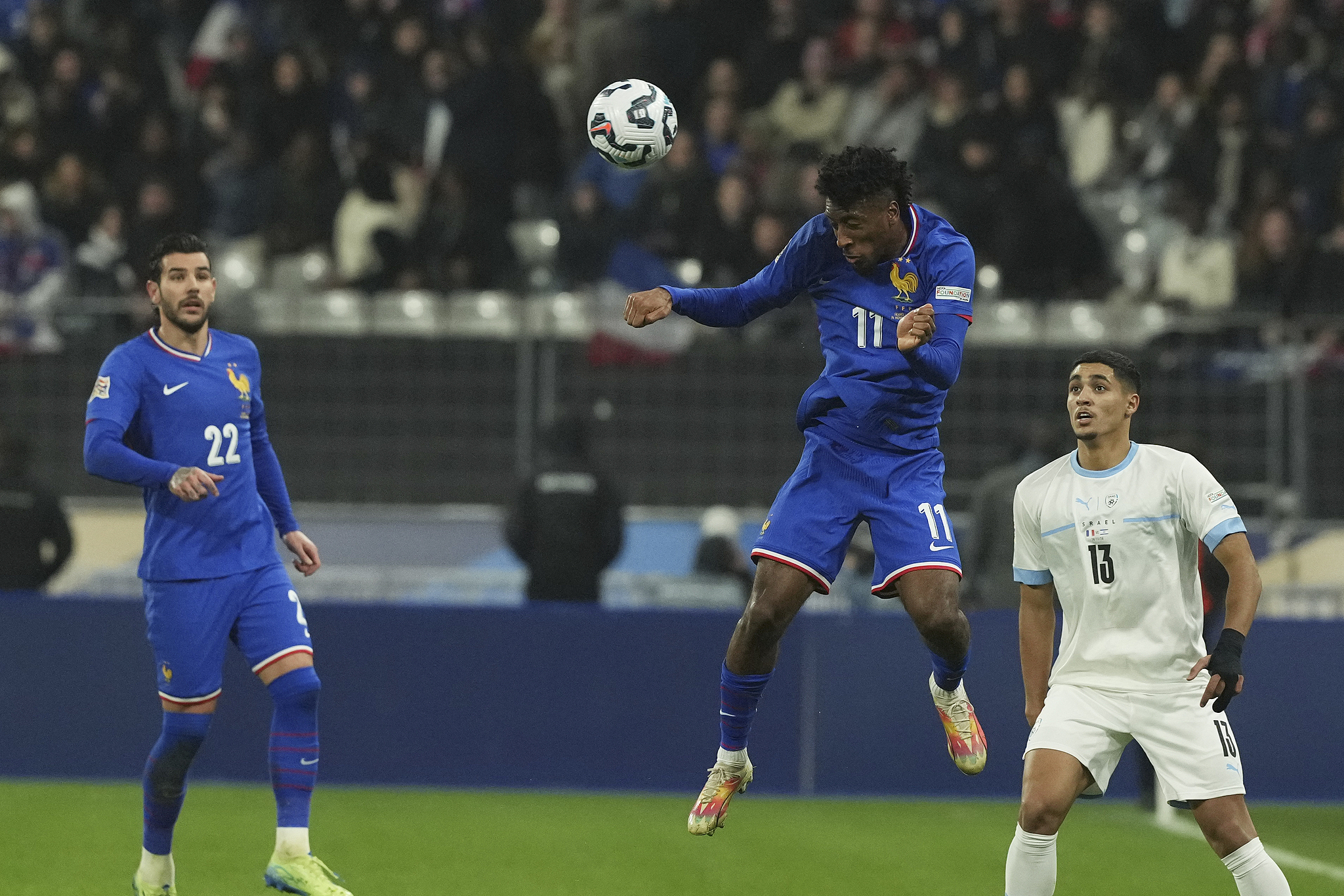 Kingsley Coman (#11) of France heads the ball against Israel in a UEFA Nations League Group A2 match at the Stade de France in Paris, France, November 14, 2024. /CFP