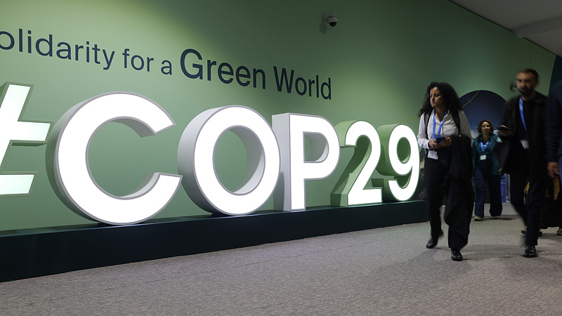 Participants walk past the hashtag COP29 logo on the opening day of COP29, the UN Climate Change Conference in Baku, Azerbaijan, November 11, 2024. /CFP