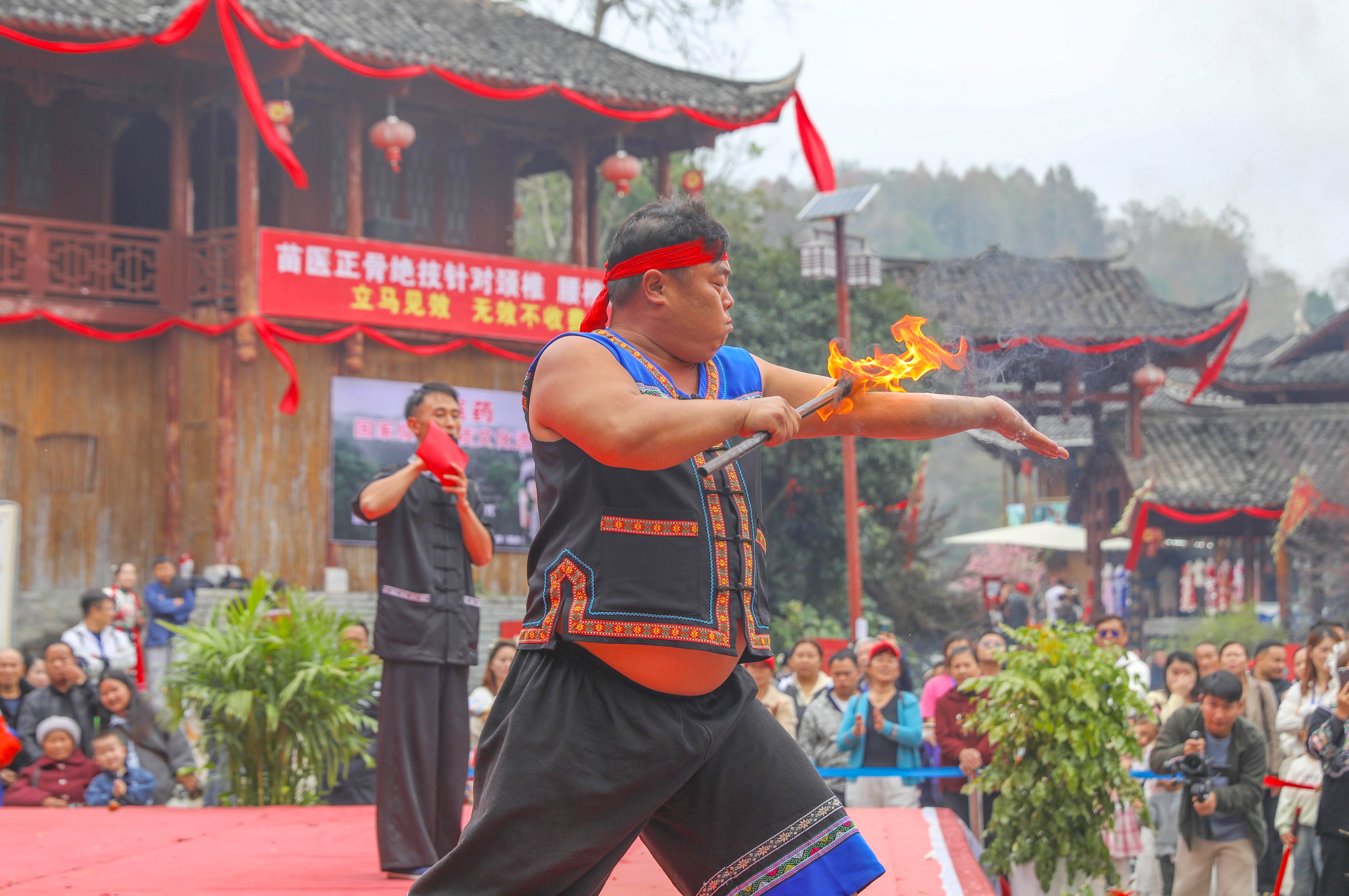 A man performs a fire stunt during the Miao New Year celebrations in Songtao Miao Autonomous County, Guizhou Province on November 16, 2024. /Photo provided to CGTN