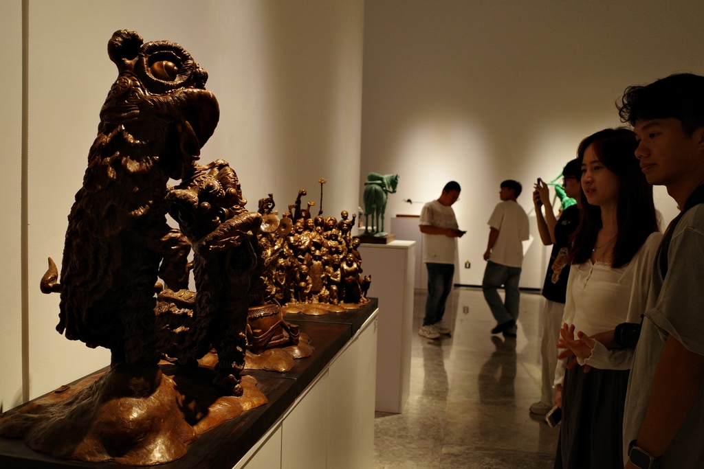 Sculptures are seen on display at the 