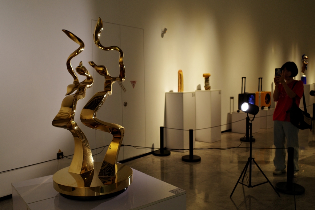 Sculptures are seen on display at the 