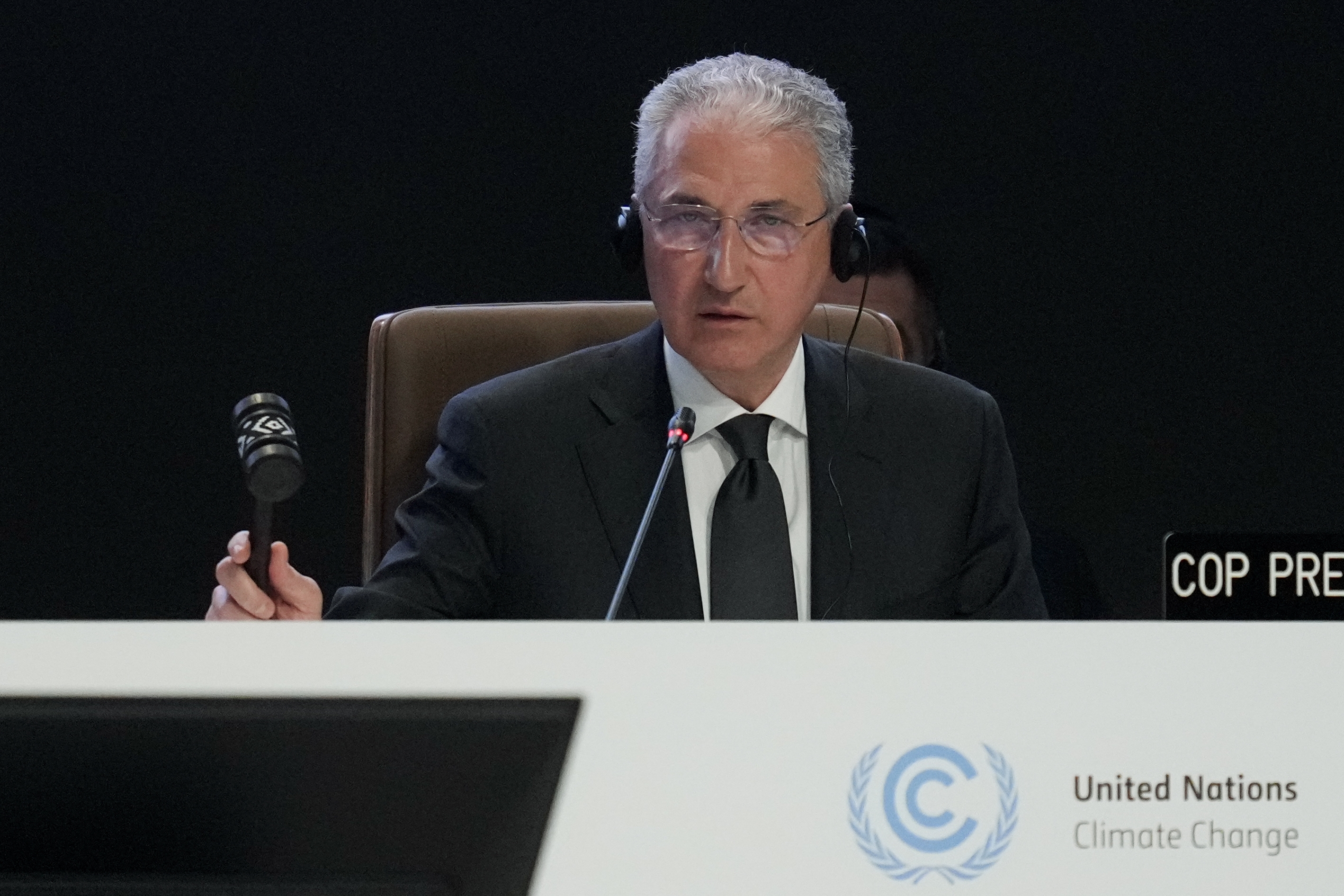 Mukhtar Babayev, COP29 president, bangs a gavel during a plenary session at the COP29 UN Climate Summit, Baku, Azerbaijan, November 18, 2024. /AP