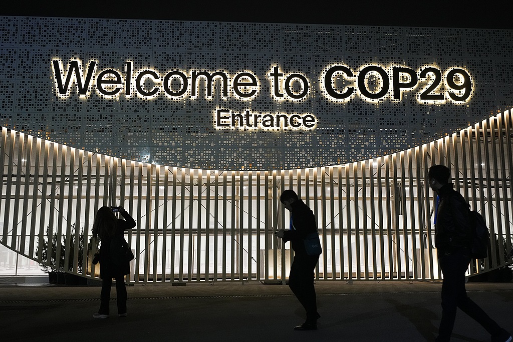 People walk outside the venue for the COP29 U.N. Climate Summit, Baku, Azerbaijan, on November 11, 2024. /CFP