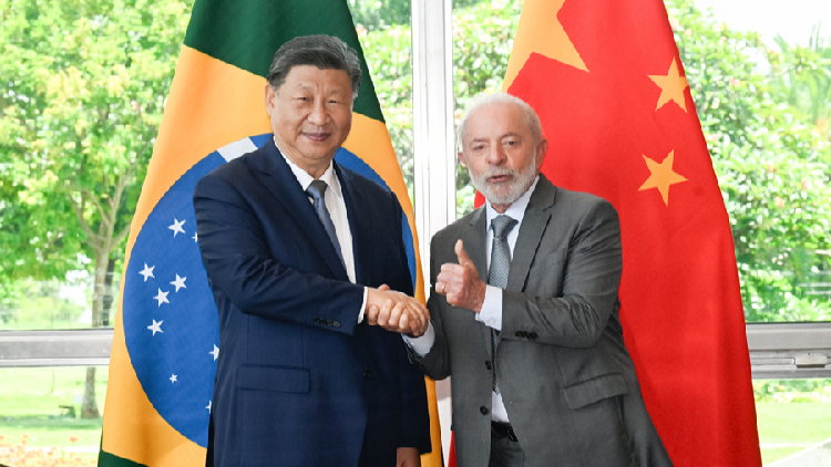 China and Brazil on Wednesday elevated their ties to a China-Brazil community with a shared future for a more just world and a more sustainable planet as Chinese President Xi Jinping and Brazilian President Luiz Inácio Lula da Silva met at the president's official residence in Brasilia.