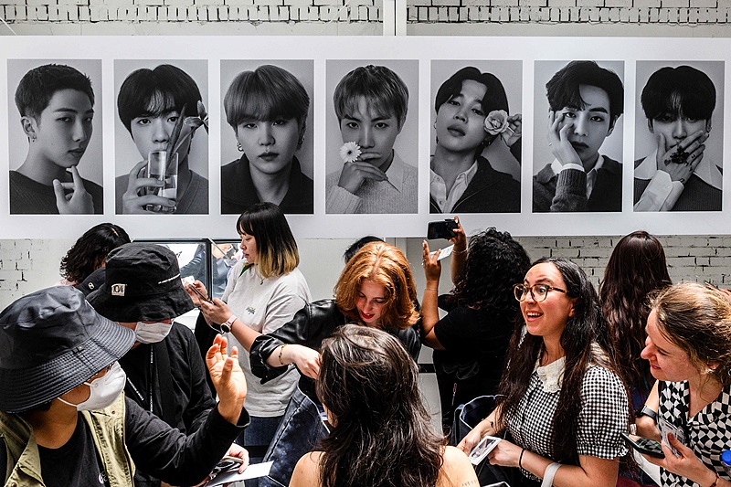 Fans wait to pay for merchandise items as they visit a pop-up store of K-pop sensation BTS entitled 