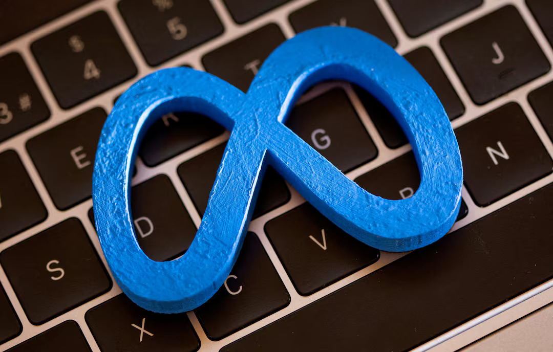 A 3D-printed logo of Meta is placed on a laptop keyboard in this photo taken on November 2, 2021. /Reuters 