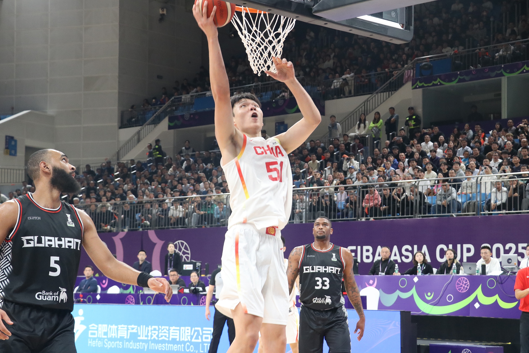 Yang Hansen (#51) of China makes a layup in the 2025 FIBA Asia Cup qualifying tournament game against Guam in Hefei, east China's Anhui Province, November 21, 2024. /CFP