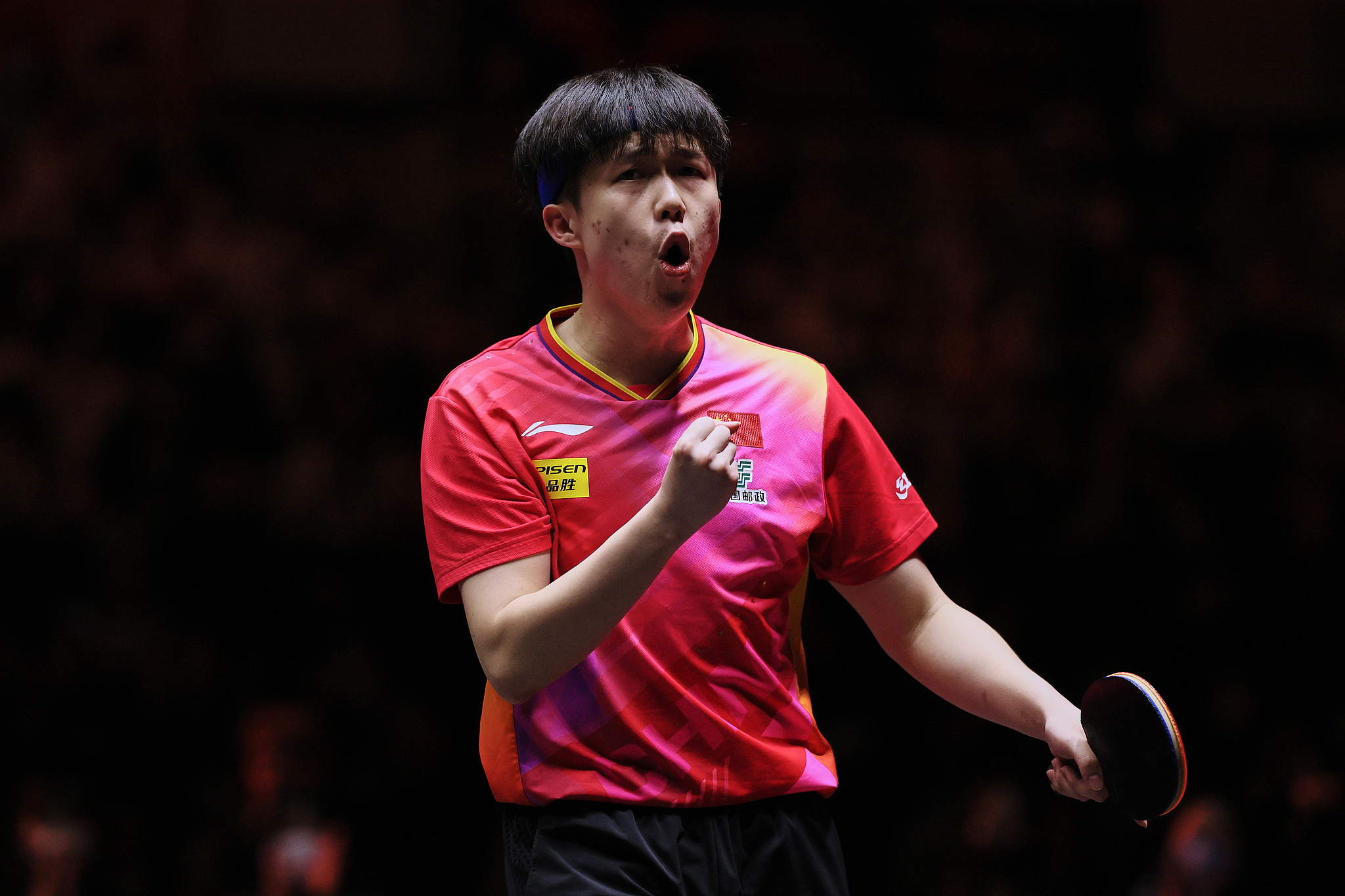 Wang Chuqin of China reacts after scoring a point in the men's singles match against Patrick Franziska of Germany in Fukuoka, Japan, November 21, 2024. /CFP