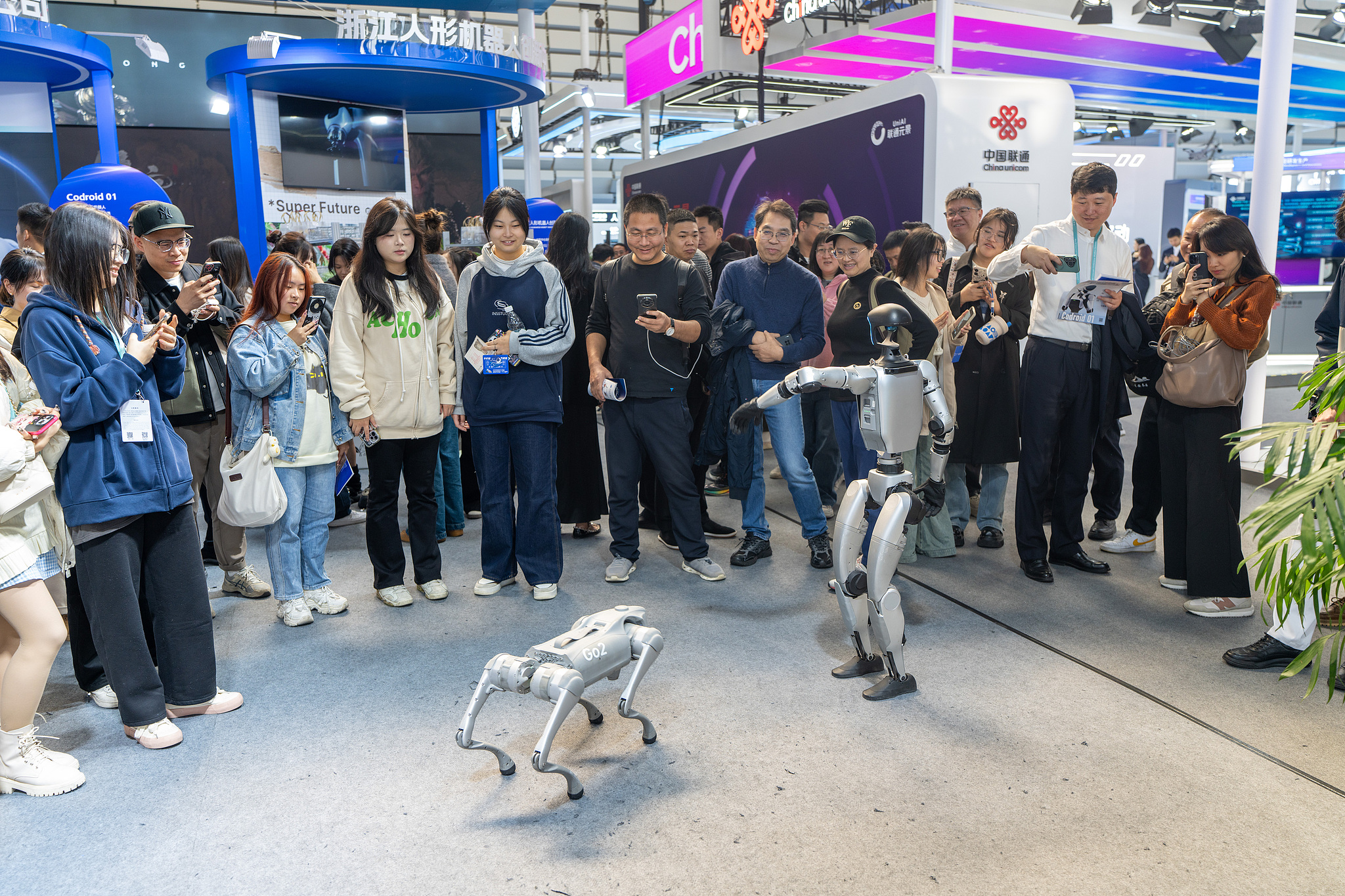 Visitors interact with intelligent robots at the Light of Internet Expo in Wuzhen, Zhejiang Province, China, November 21, 2024. /CFP