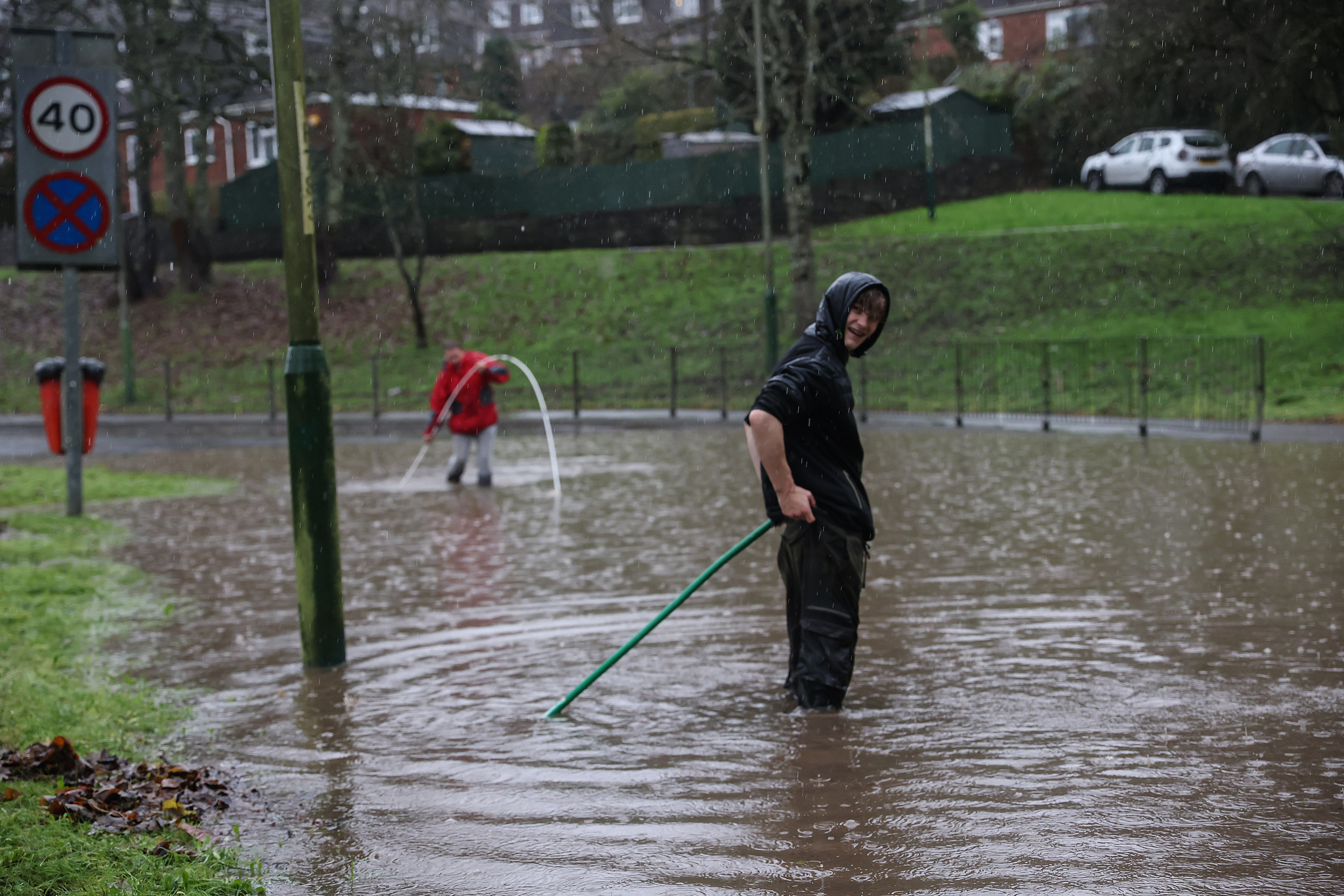 Residents of Abercarn attempt to clear drains to allow the water to subside in Abercarn, Newport, Wales, November 24, 2024. /CFP