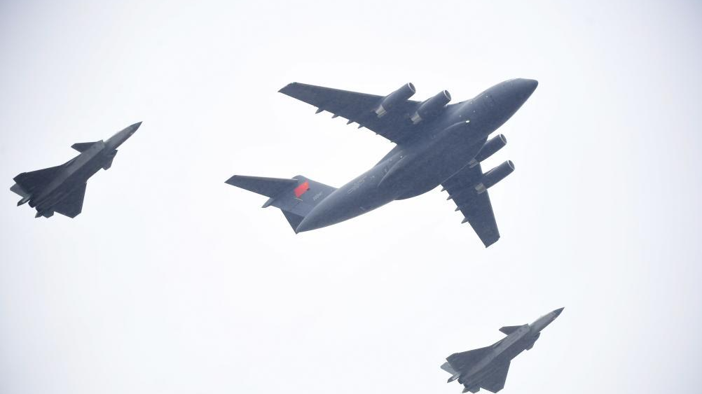 Two fighter jets escorted a transport aircraft carrying the remains of CPV martyrs back to China, November 23, 2023. /Xinhua