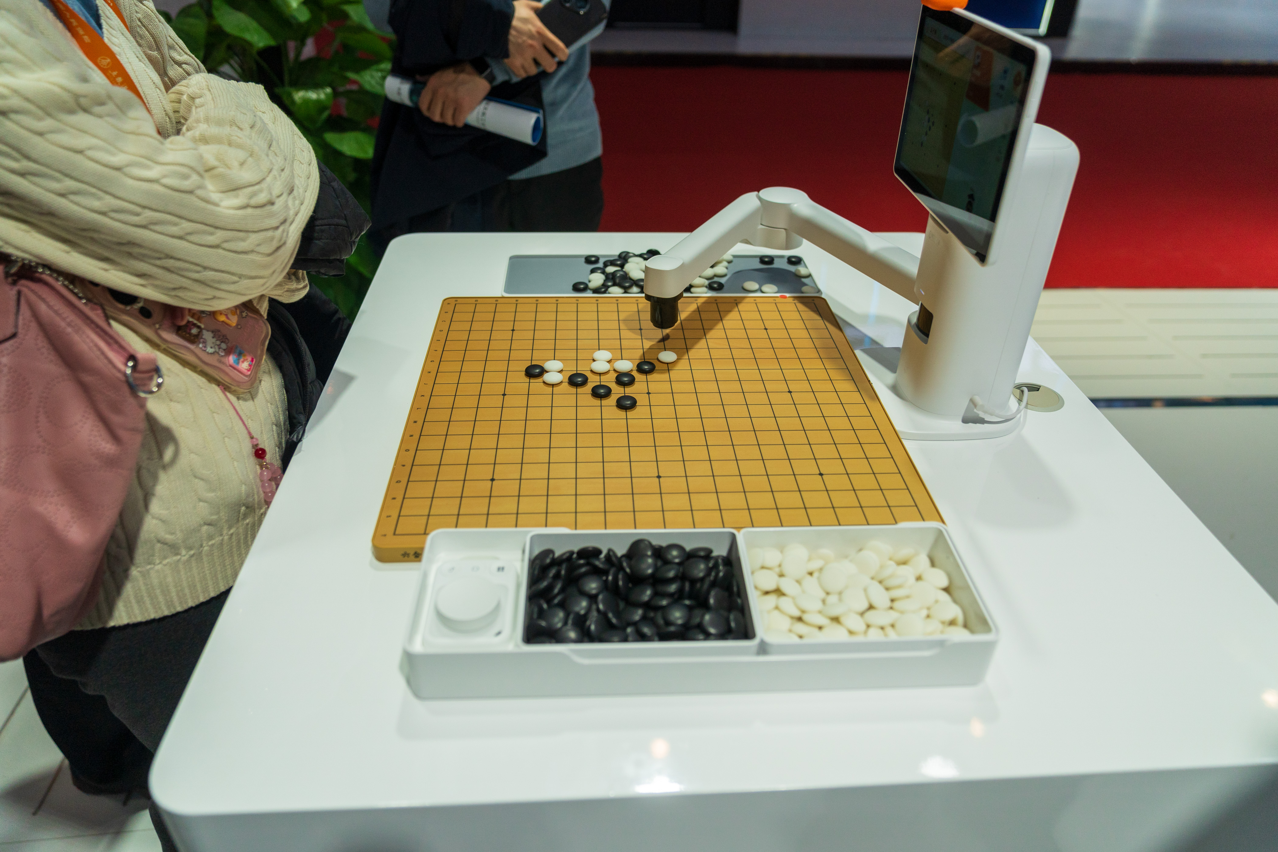 Playing checkers with a robot arm at the exhibition area of Digital Technology Chain, November 26, 2024. 