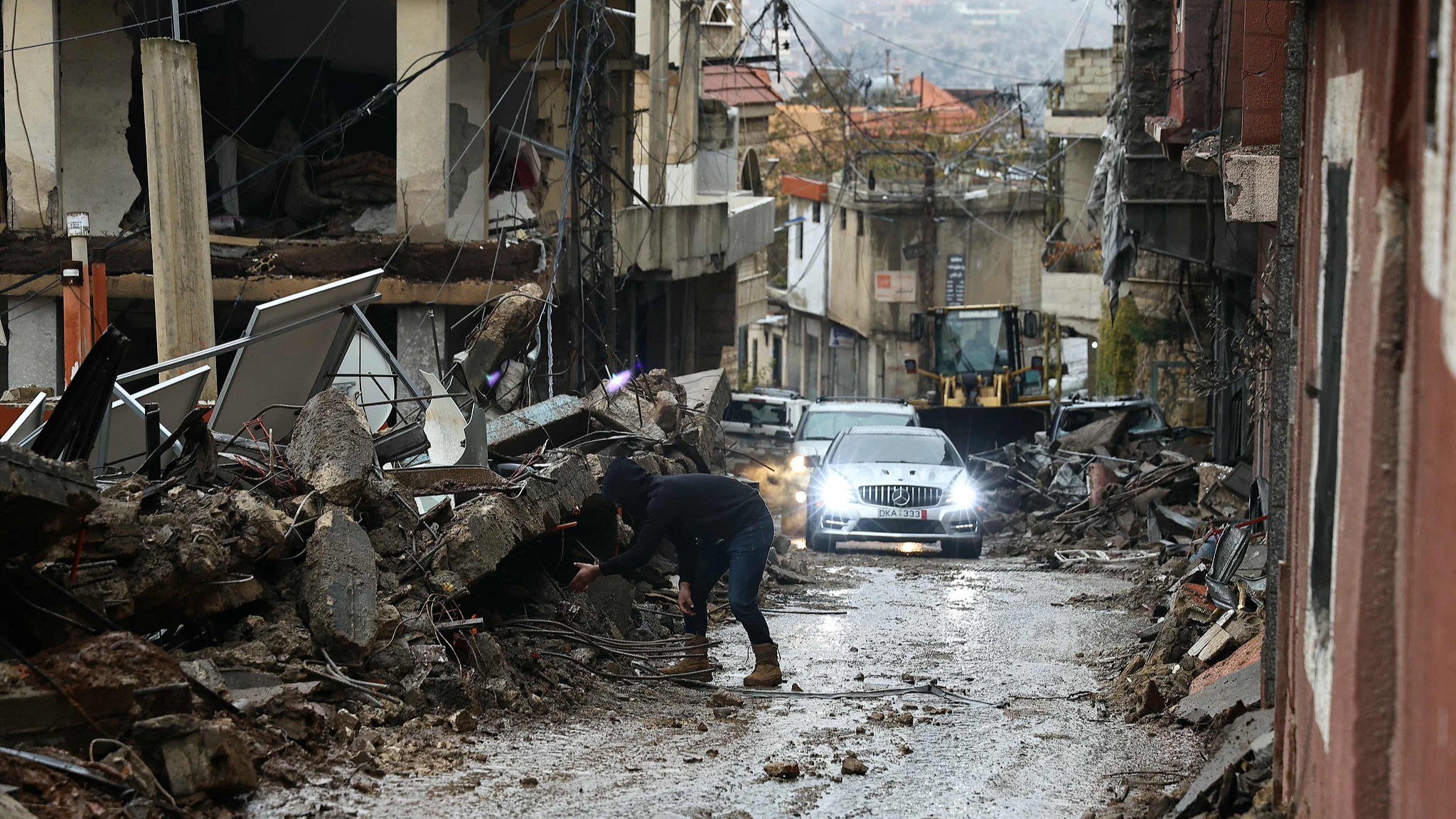 A resident who had fled the southern Lebanese border village of Shebaa, checks the damage upon his return following a ceasefire between Israel and Hezbollah that took effect on November 27, 2024. /CFP