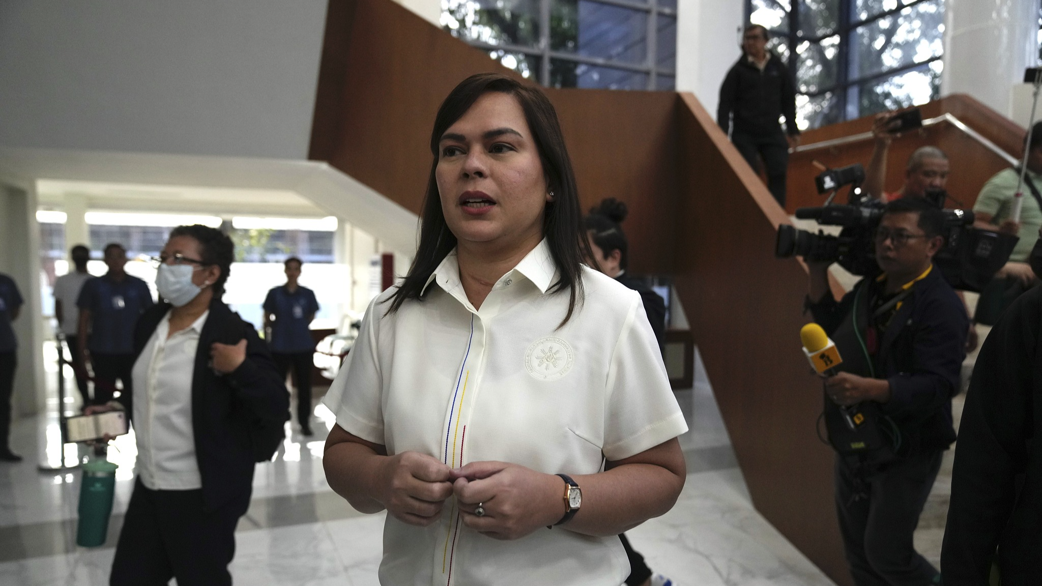 Philippine Vice President Sara Duterte, center, walks while a hearing she is attending is suspended at the House of Representative in Quezon City, Philippines, Monday, November 25, 2024. /CFP