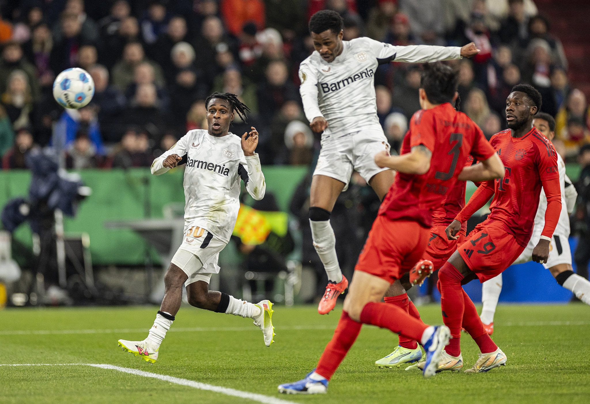 Nathan Tella (#19) of Bayer Leverkusen scores a header in the DFB-Pokal (German Cup) game against Bayern Munich at Allianz Arena in Munich, Germany, December 3, 2024. /CFP 