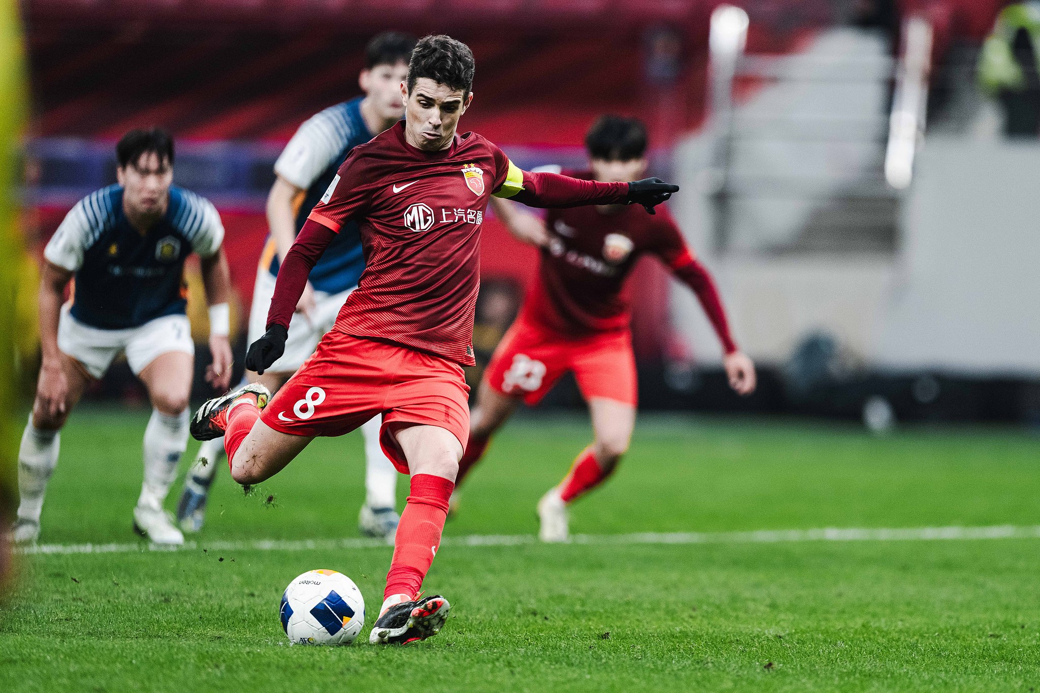 Oscar (#8) of Shanghai Port shoots to score a penalty kick in the Asian Football Confederation (AFC) Champions League Elite game against Gwangju in east China's Shanghai Municipality, December 3, 2024. /CFP