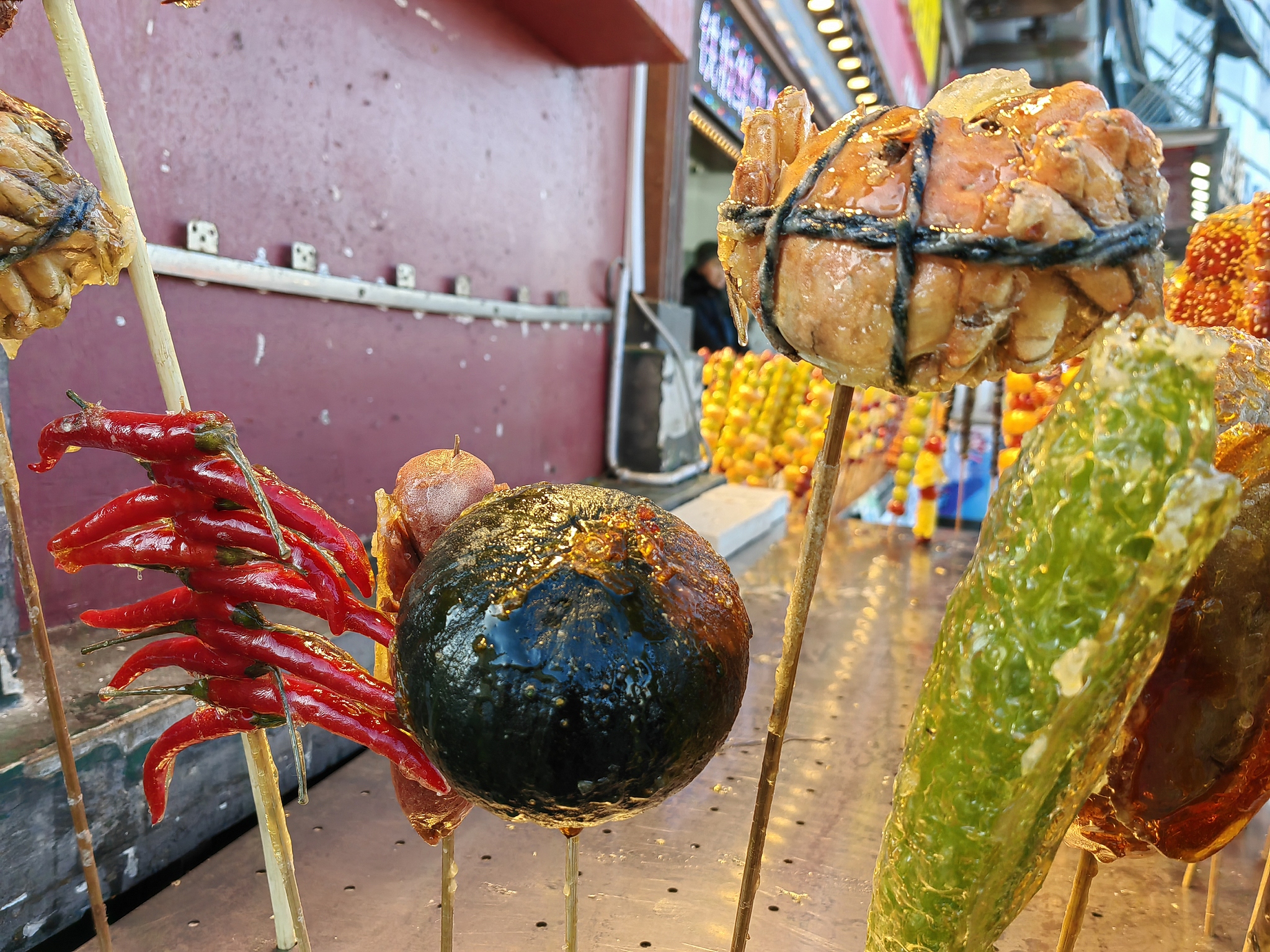 Various kinds of tanghulu snacks are displayed outside a shop in Harbin, Heilongjiang Province, December 2, 2024. /CFP