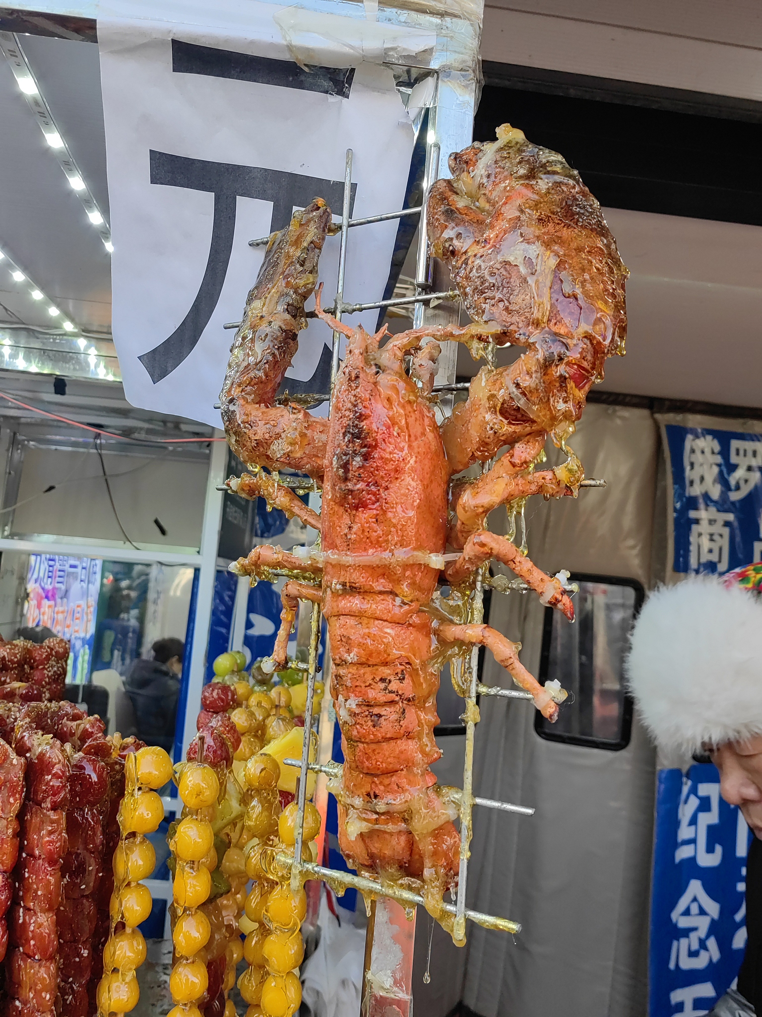 Various kinds of tanghulu snacks are displayed outside a shop in Harbin, Heilongjiang Province, December 2, 2024. /CFP