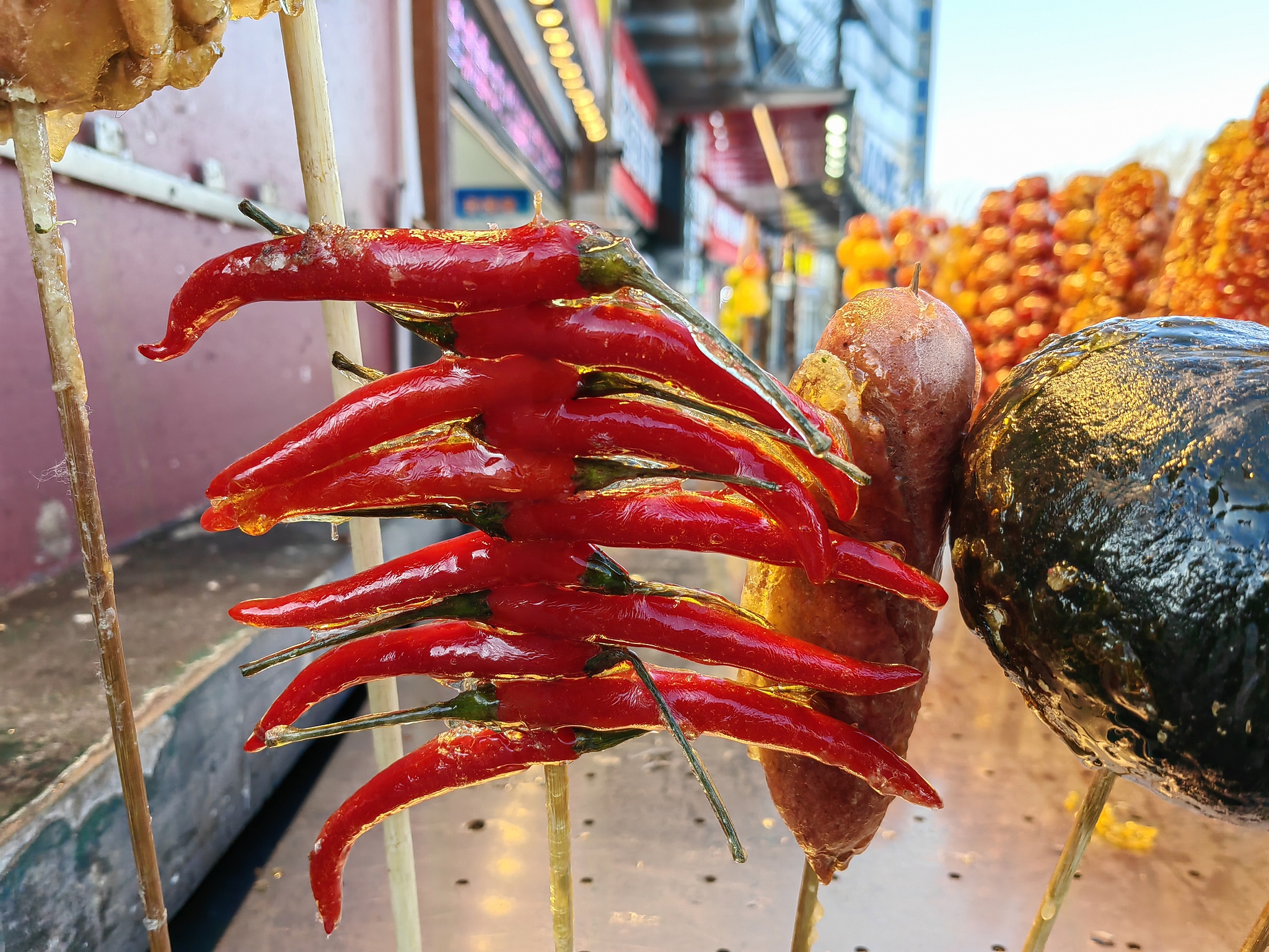 Various kinds of tanghulu snacks are displayed outside a shop in Harbin, Heilongjiang Province, December 2, 2024. /CFP