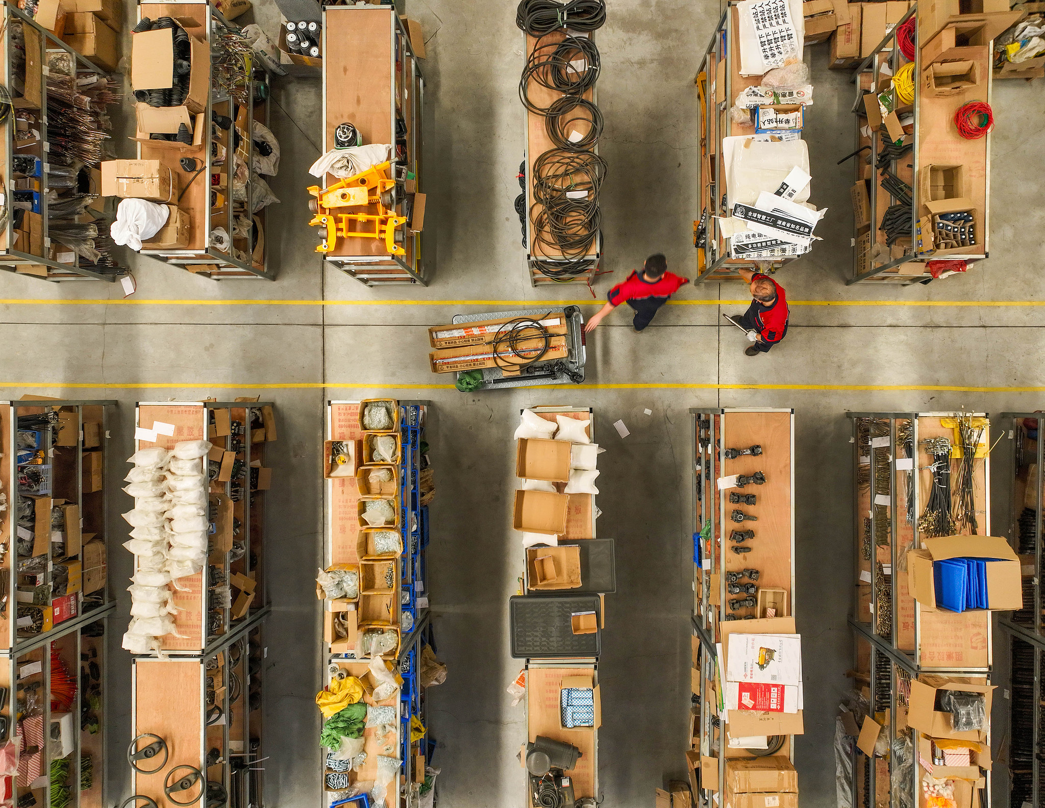 Workers select parts at an agricultural equipment company warehouse in Daoxian high-tech zone in Yongzhou, Hunan Province, China, May 21, 2024. /CFP