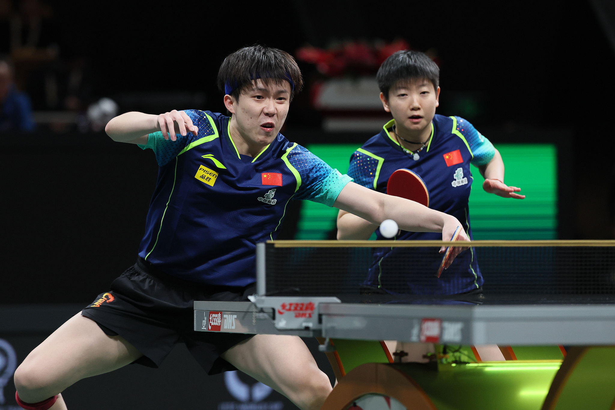 Wang Chuqin (L) and Sun Yingsha of China compete in the mixed doubles matcha against Yiu Kwan To and Ng Wing Lam of Hong Kong SAR in Chengdu, southwest China's Sichuan Province, December 5, 2024. /CFP