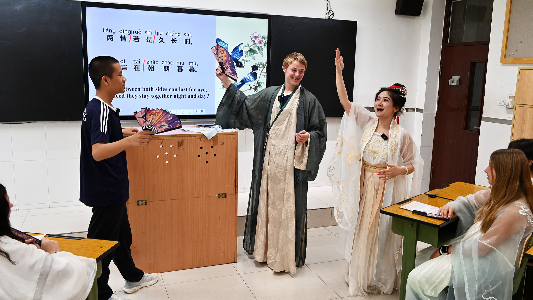 Students from China and the United States perform during a cultural class about the Chinese Valentine's Day at the Shijiazhuang Foreign Language School in Shijiazhuang City, north China's Hebei Province, August 10, 2024. /CFP