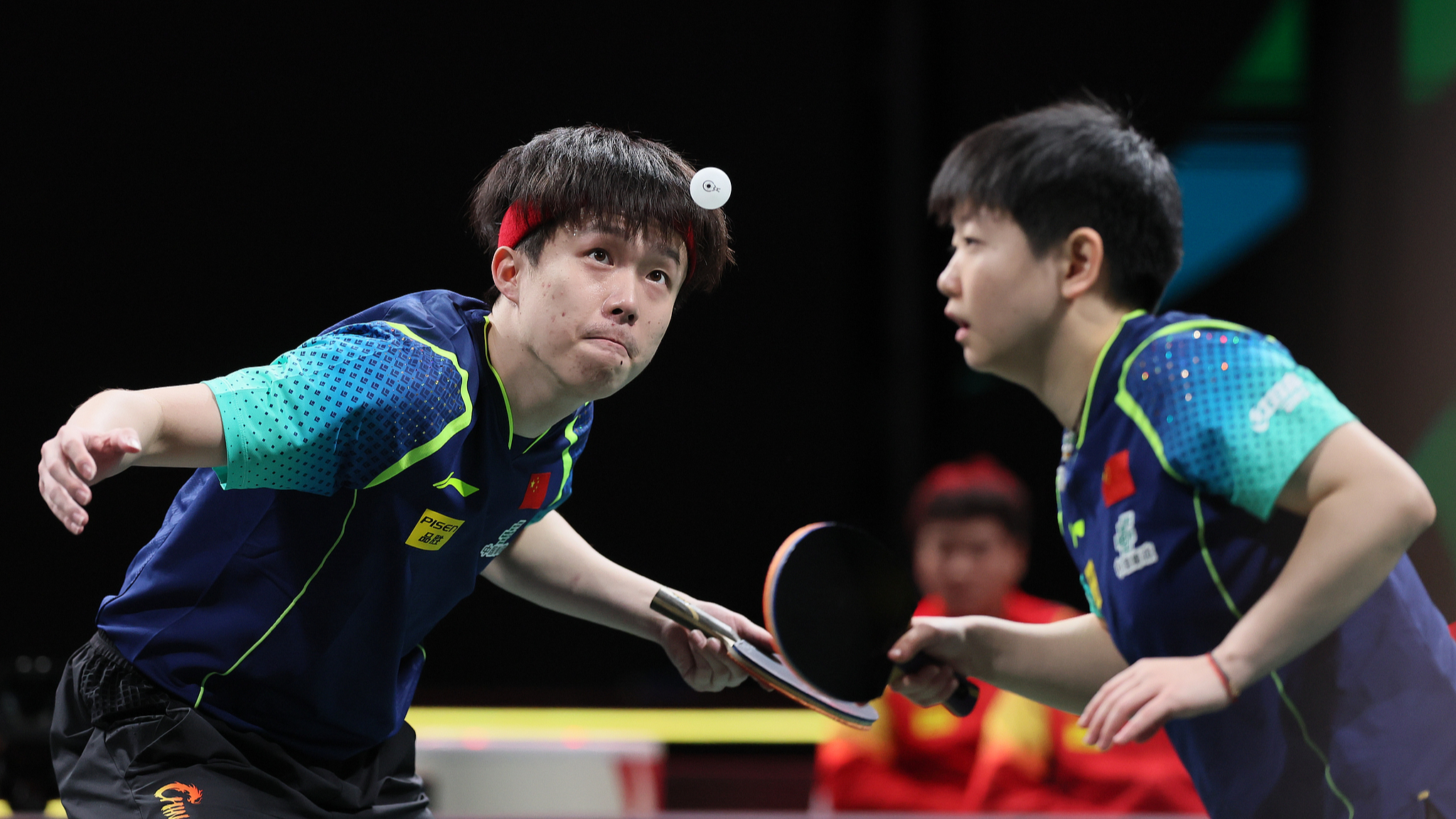 Wang Chuqin (L) and Sun Yingsha in action during ITTF Mixed Team World Cup semifinals in Chengdu, Sichuan Province, China, December 8, 2024. /CFP