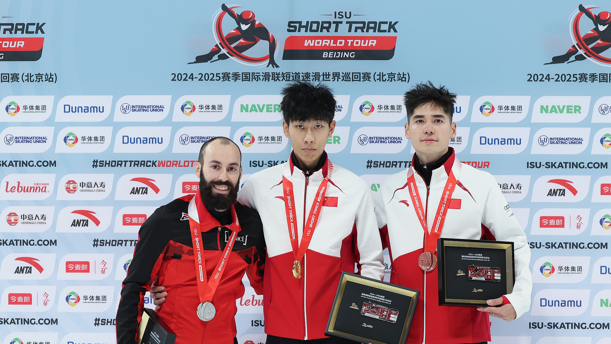 L-R: Steven Dubois, Sun Long and Liu Shaoang pose with at men's 500m award ceremony during ISU Short Track Speed Skating World Tour in Beijing, China, December 7, 2024. /CFP